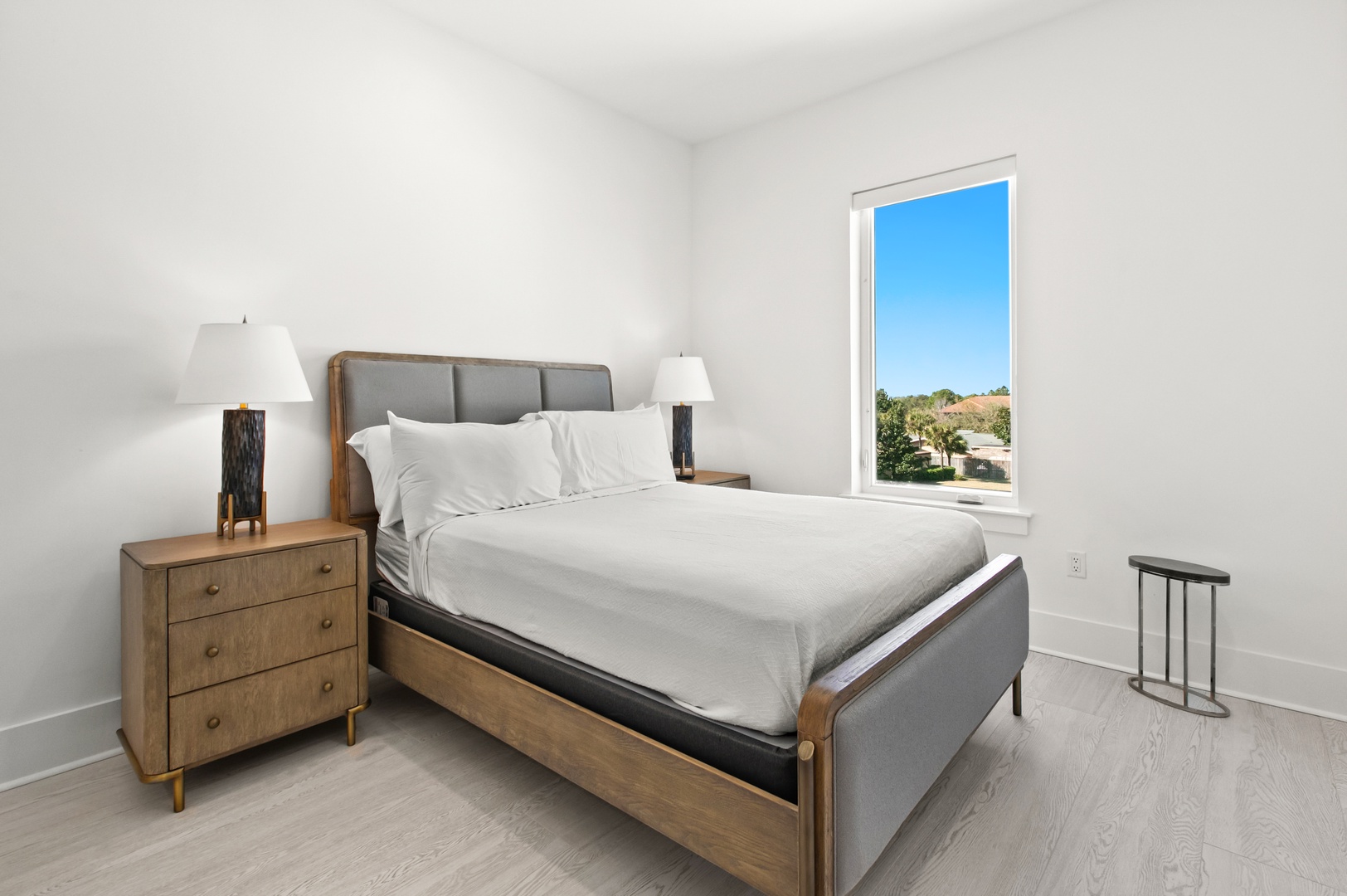 Sink into crisp linens and let the bright California sunshine fill your tranquil retreat, framed by a window that invites the outdoors in.