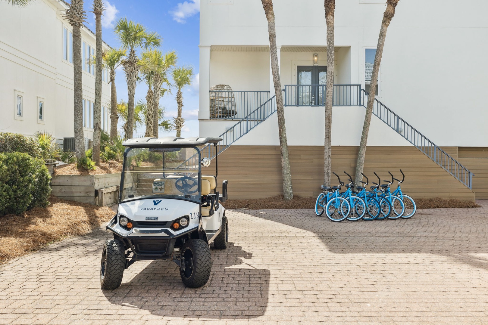 Modern beachside property with complimentary bicycles and golf cart for easy transportation around the area.