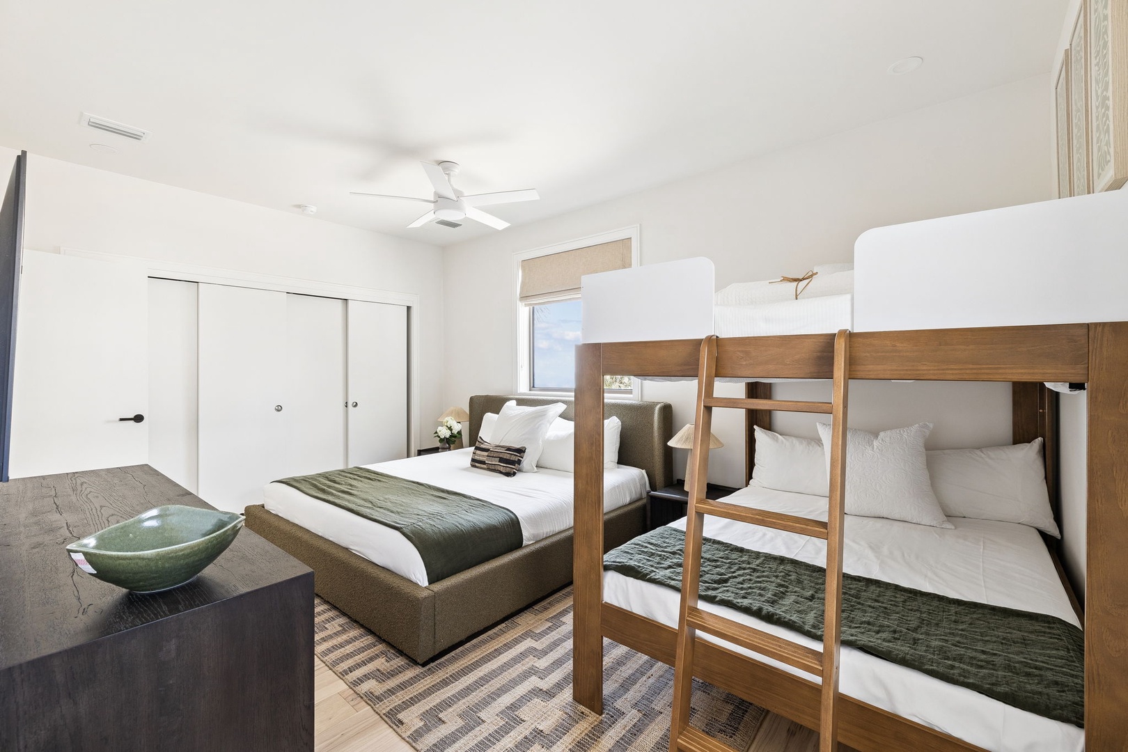 Drift off in your spacious bedroom with cozy bunk beds and a queen bed, perfect for families. Fresh linens and peaceful vibes await.