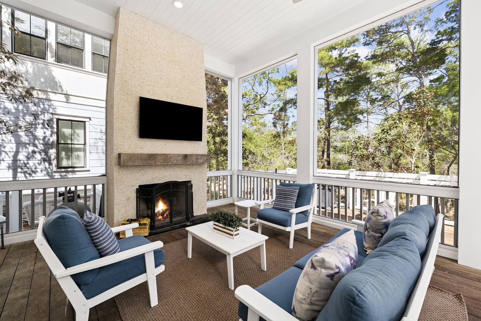 Unwind on your screened porch with a crackling fireplace, plush seating, and peaceful forest views.