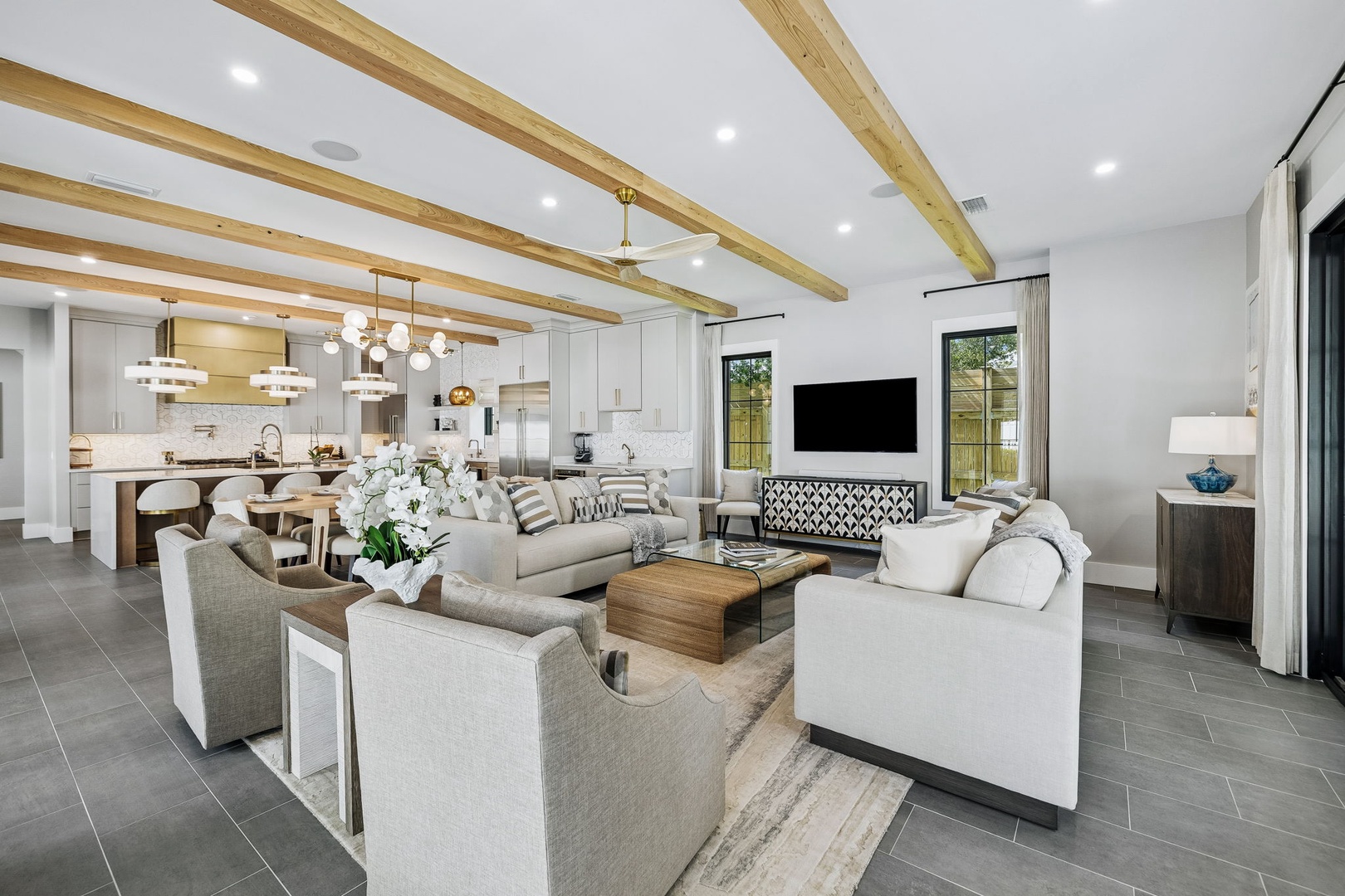 Gather with your group in this beautifully designed open living space, where exposed beams and modern comfort create the perfect backdrop for memorable moments together.
