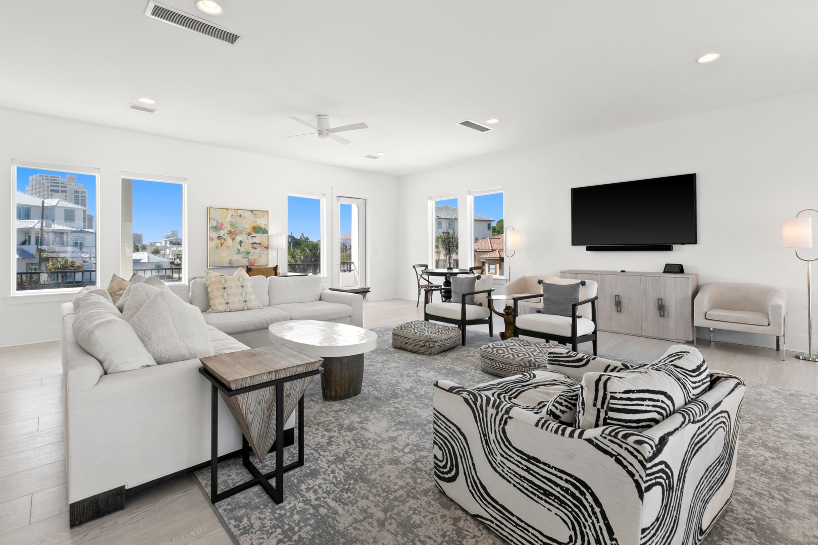 Sink into plush seating and enjoy your favorite shows in this bright, contemporary living space. Large windows frame city views, while modern furnishings create the perfect atmosphere for relaxing after exploring the area.