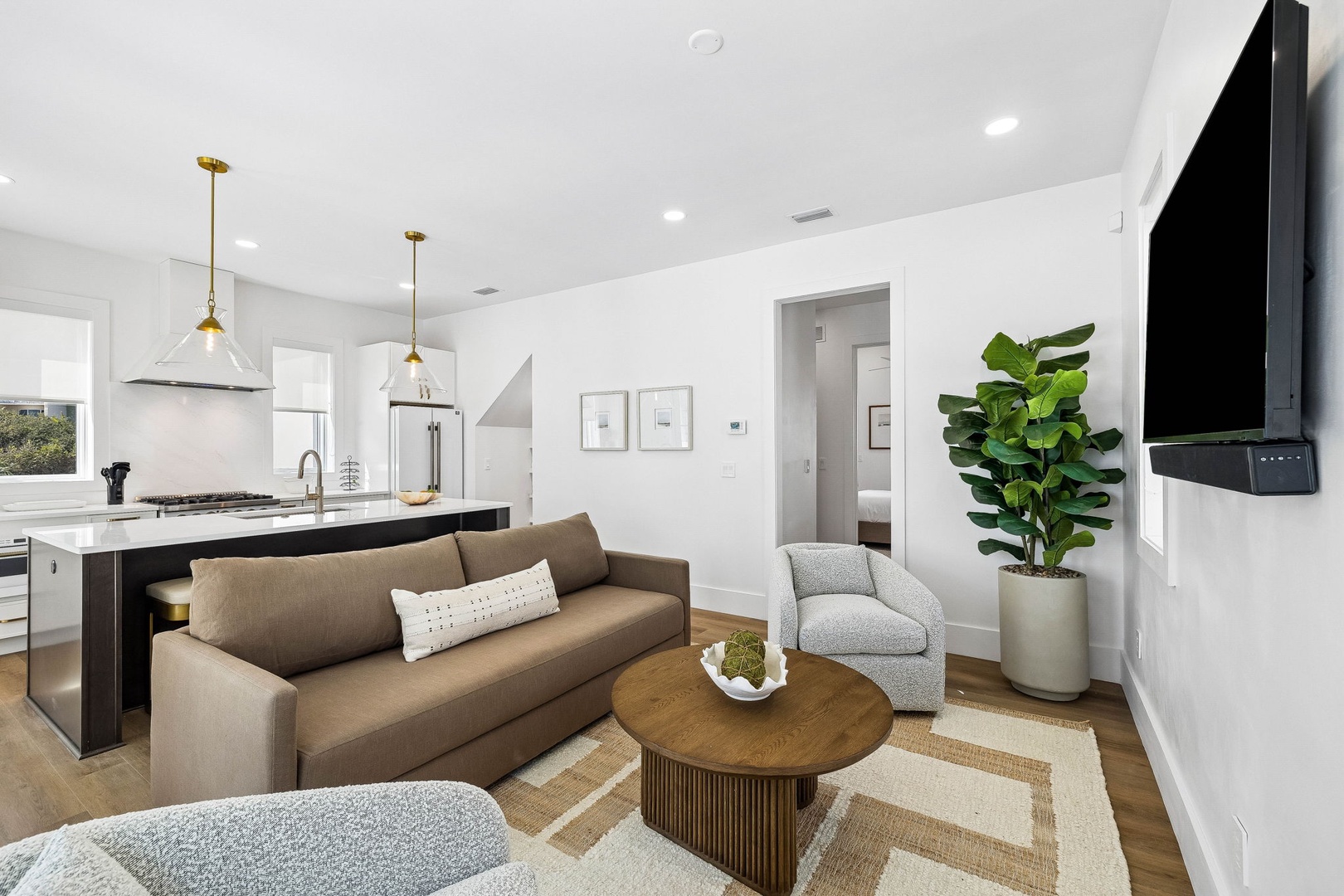 Relax in your bright open-plan space where the living room flows seamlessly into the modern kitchen. Stylish finishes, high ceilings, and abundant natural light create a welcoming retreat you'll love coming home to.