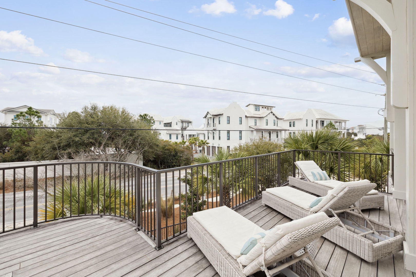 Soak up the sunshine on your private deck with comfy loungers and peaceful neighborhood views through tropical palms.