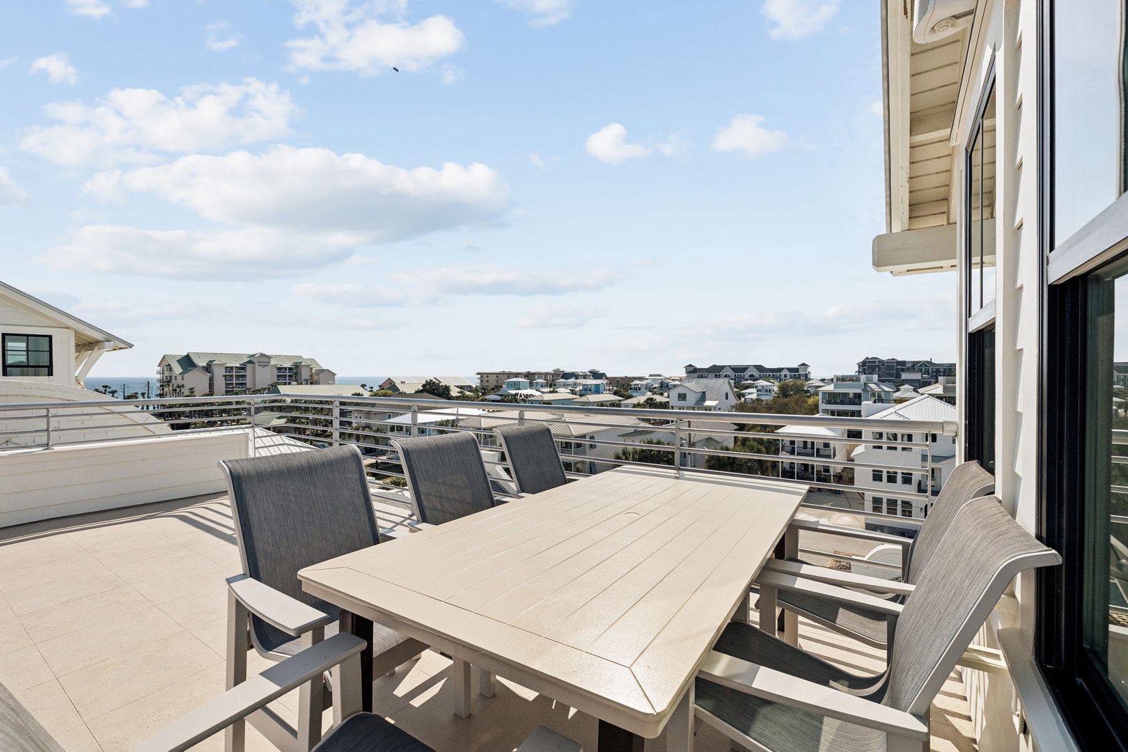 Gather around your private rooftop dining table while soaking in panoramic views of the coastal community below.