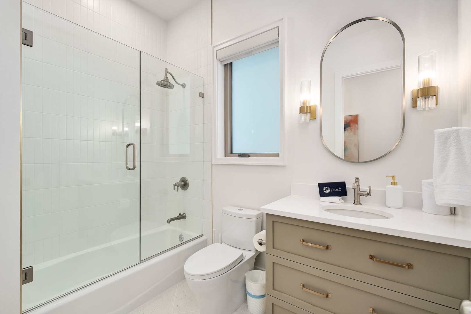 Step into your sleek bathroom featuring a glass-enclosed shower, elegant vanity, and warm lighting that creates your perfect morning routine.