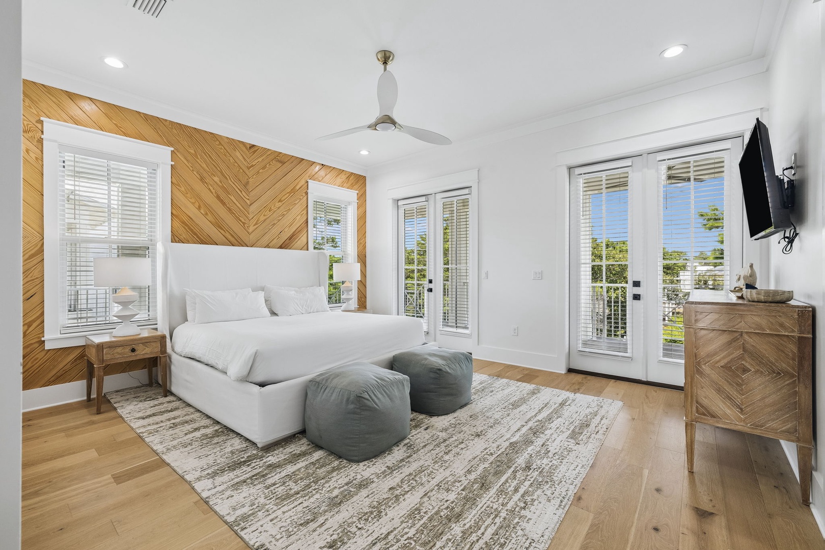 Sink into your cloud-like bed and let the ceiling fan's gentle breeze lull you to sleep. Sunshine pours through French doors leading to your private outdoor space—perfect for morning coffee.
