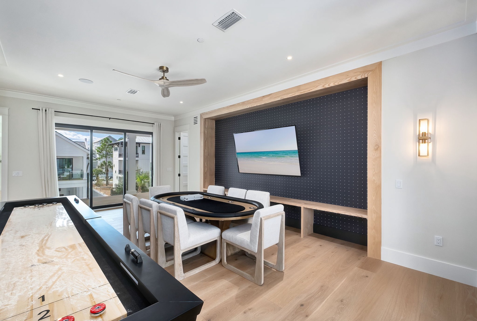 Your game room awaits with a custom poker table and shuffleboard—perfect for friendly competition and laughter-filled evenings with your crew.