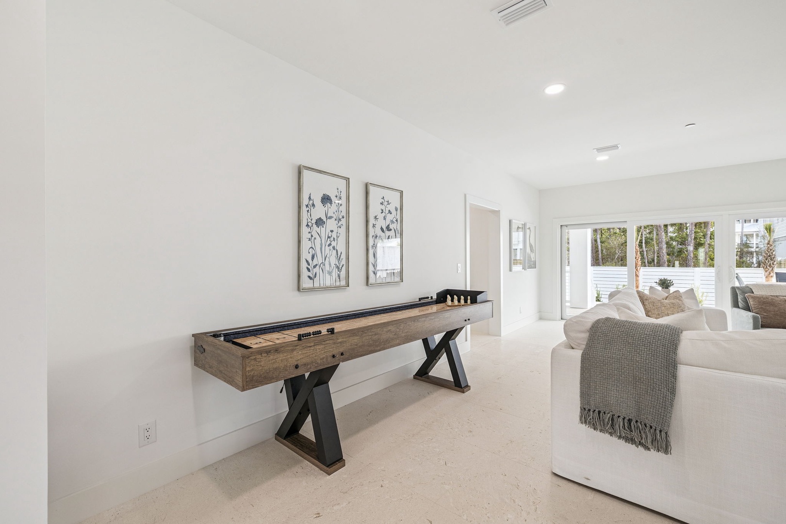 Unwind in your spacious living area with a shuffleboard table for friendly competitions and comfortable seating for relaxing evenings.