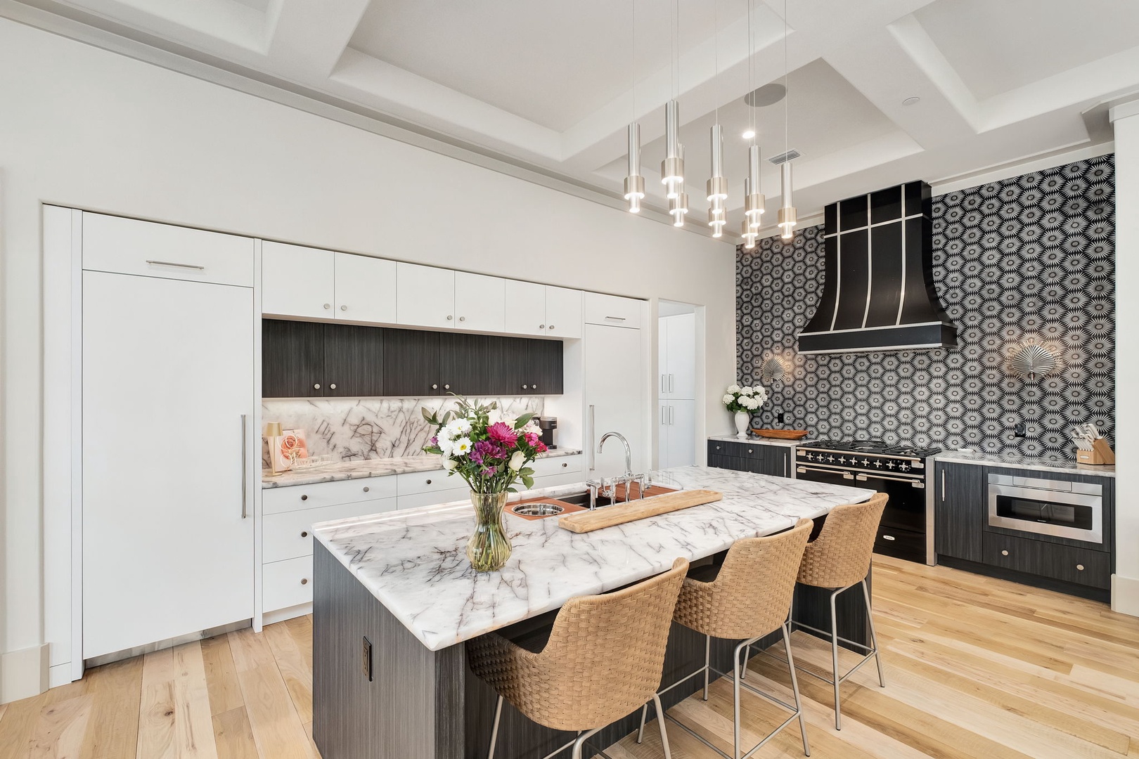 Your gourmet kitchen awaits with marble countertops, modern appliances, and elegant pendant lighting for memorable meal preparation.