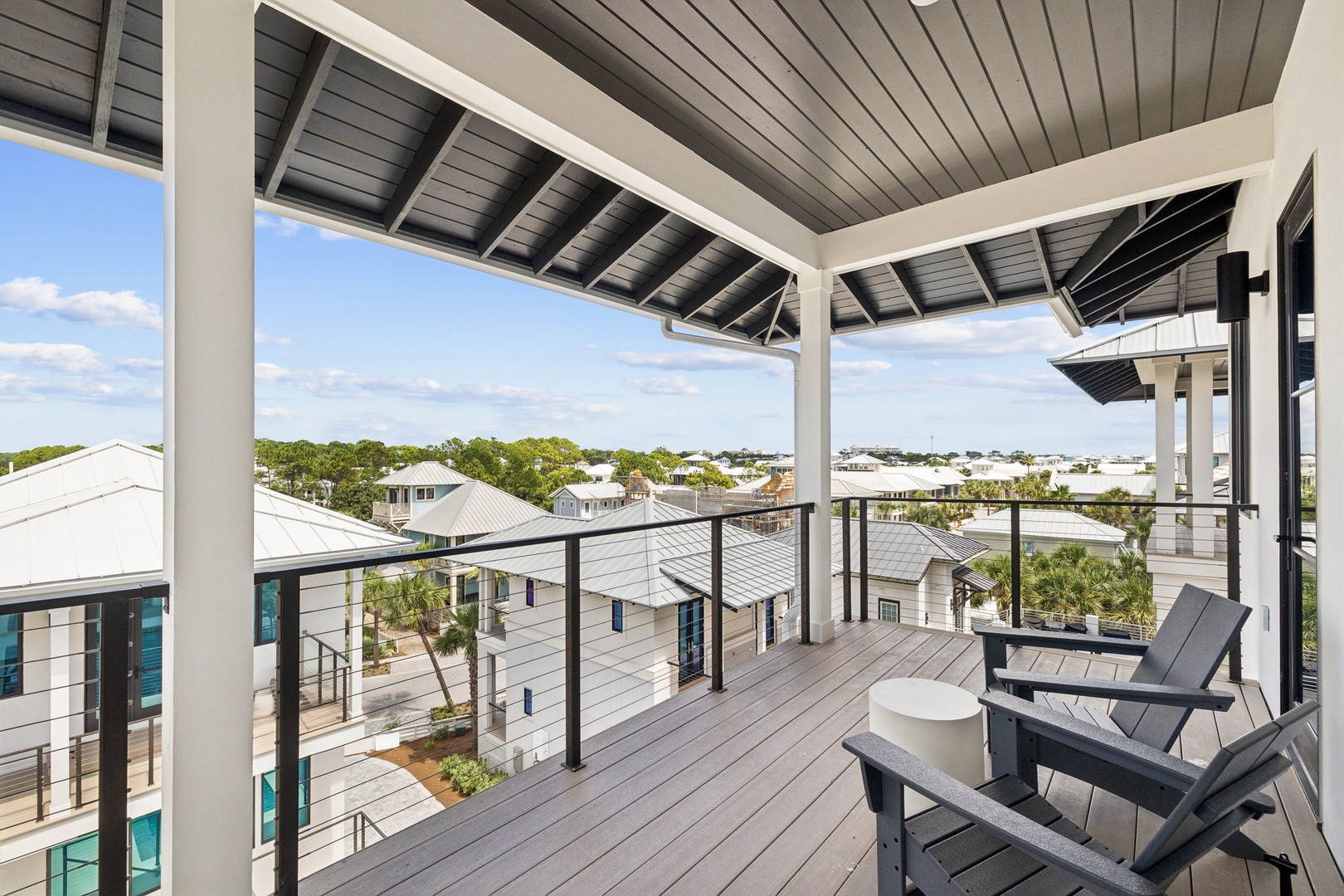 Unwind on your private covered balcony with comfortable seating and peaceful rooftop views. Perfect for morning coffee or evening relaxation under the sheltered outdoor space.