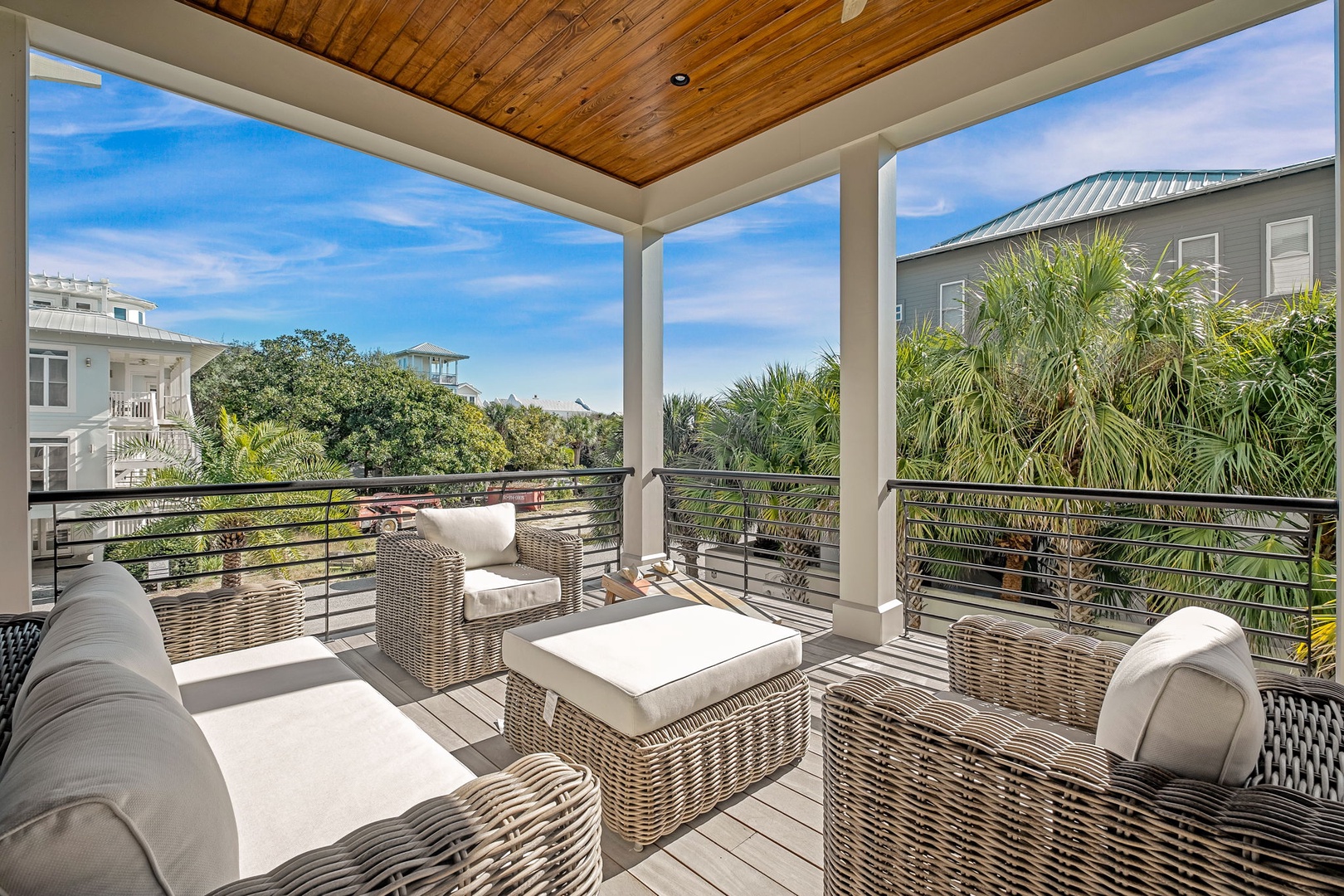 Unwind on your private covered terrace with plush seating and tropical views—the perfect spot for morning coffee or evening relaxation.