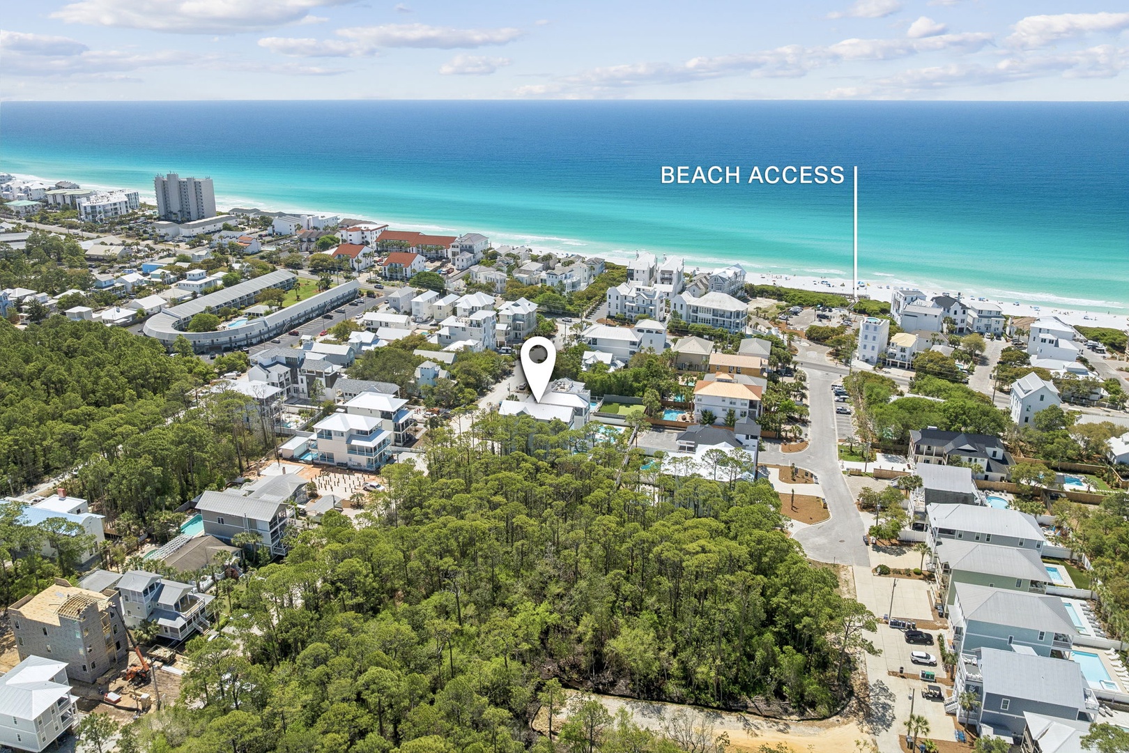 Aerial view showcasing the property's prime location near pristine beaches with convenient access to the turquoise waters and white sand coastline.