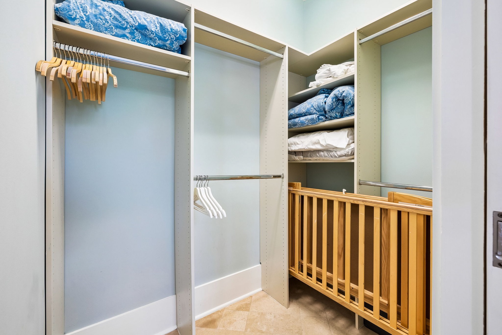 Your spacious walk-in closet features generous hanging space, organized shelving for linens and luggage, and thoughtful storage designed for effortless unpacking and relaxing during your stay.