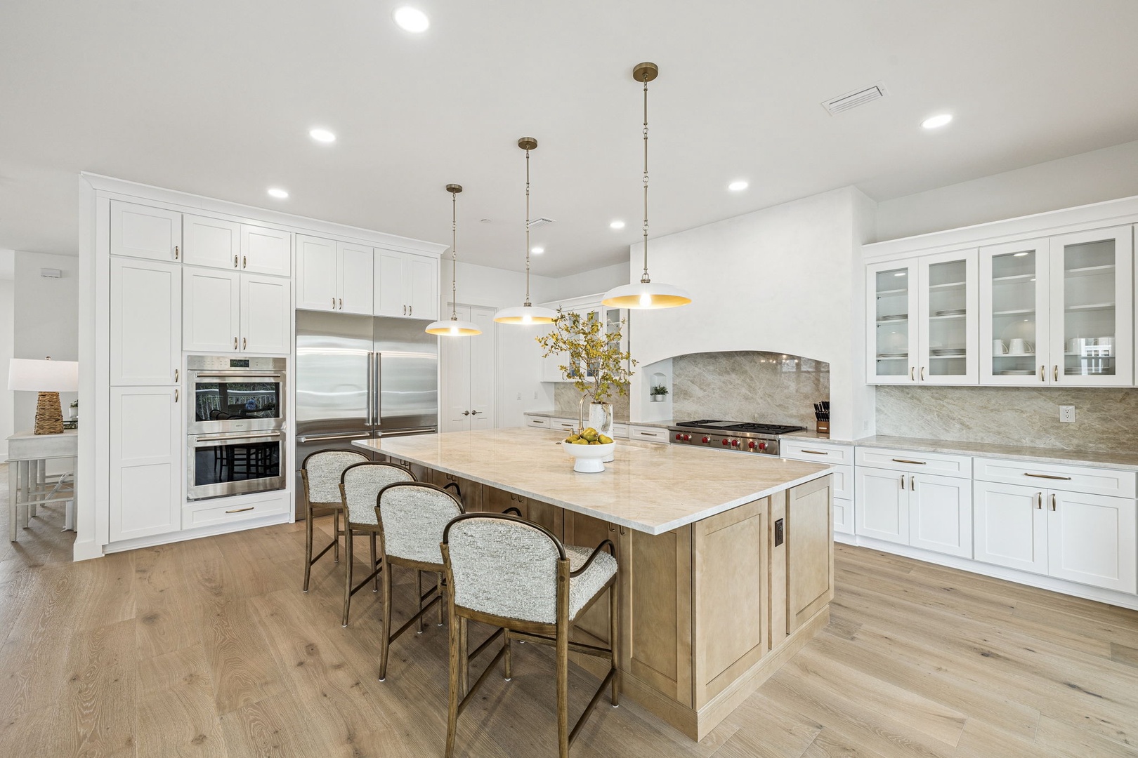 Your spacious gourmet kitchen invites culinary adventures with premium appliances, elegant marble countertops, and a stunning island perfect for gathering.