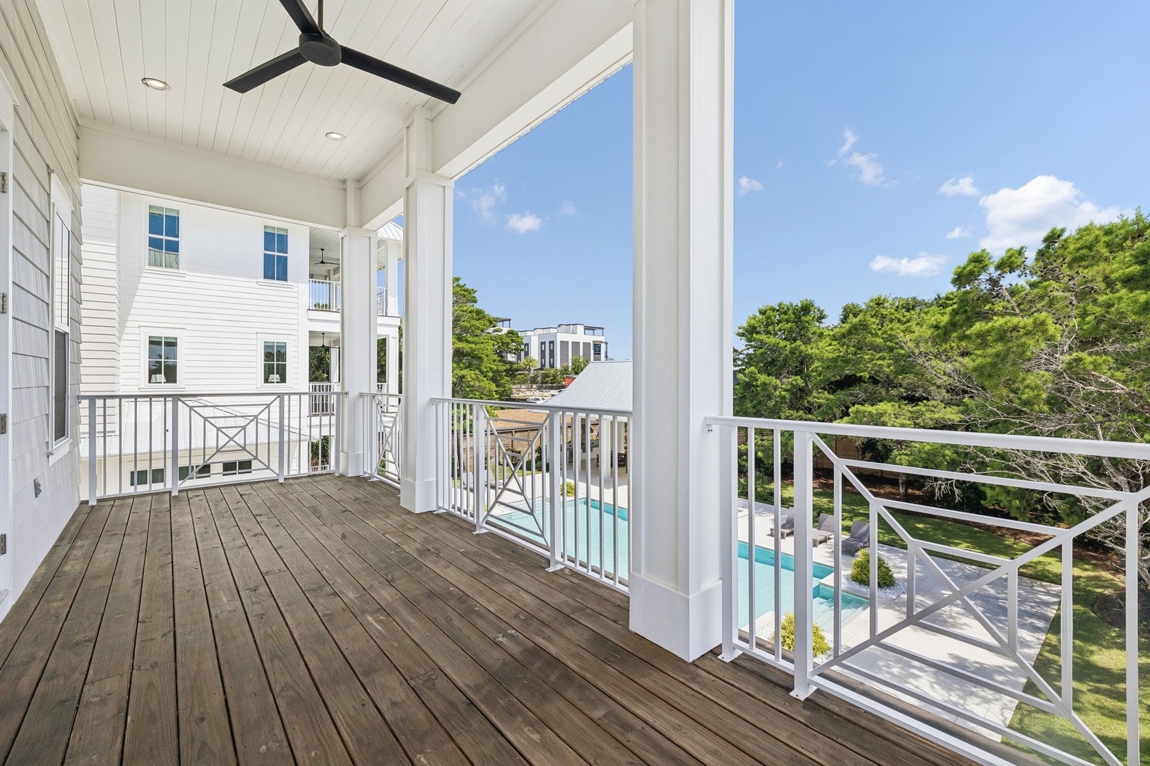 Step out onto your private covered balcony and breathe in the fresh air. From here, you'll catch glimpses of the sparkling pool below and lush greenery all around, creating your perfect spot for morning coffee or evening wind-down.