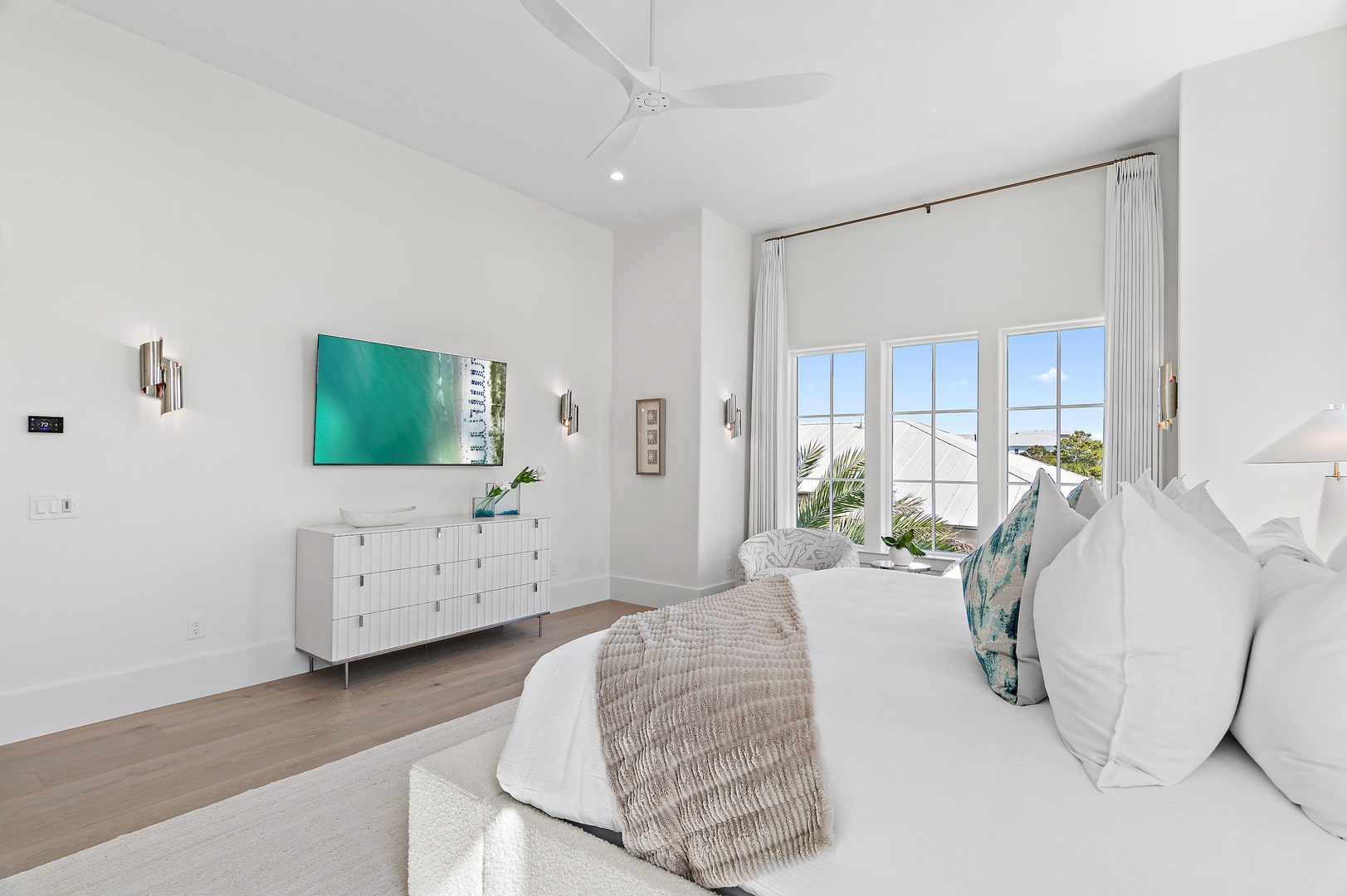 Sink into crisp white linens and let the coastal breeze through your windows refresh you. The airy vaulted ceilings and serene teal accents create a tranquil retreat after days of adventure.