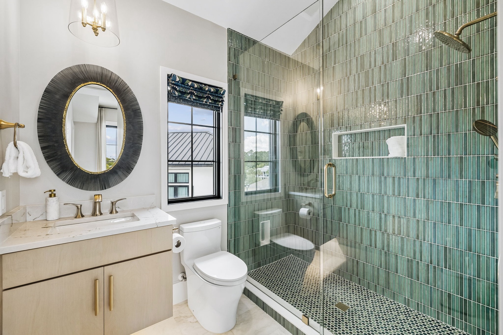 Step into this stunning bathroom where spa-like serenity awaits. Beautiful aqua tilework adorns your walk-in shower, while natural light streams through the window. Every detail is thoughtfully designed for your comfort and relaxation.