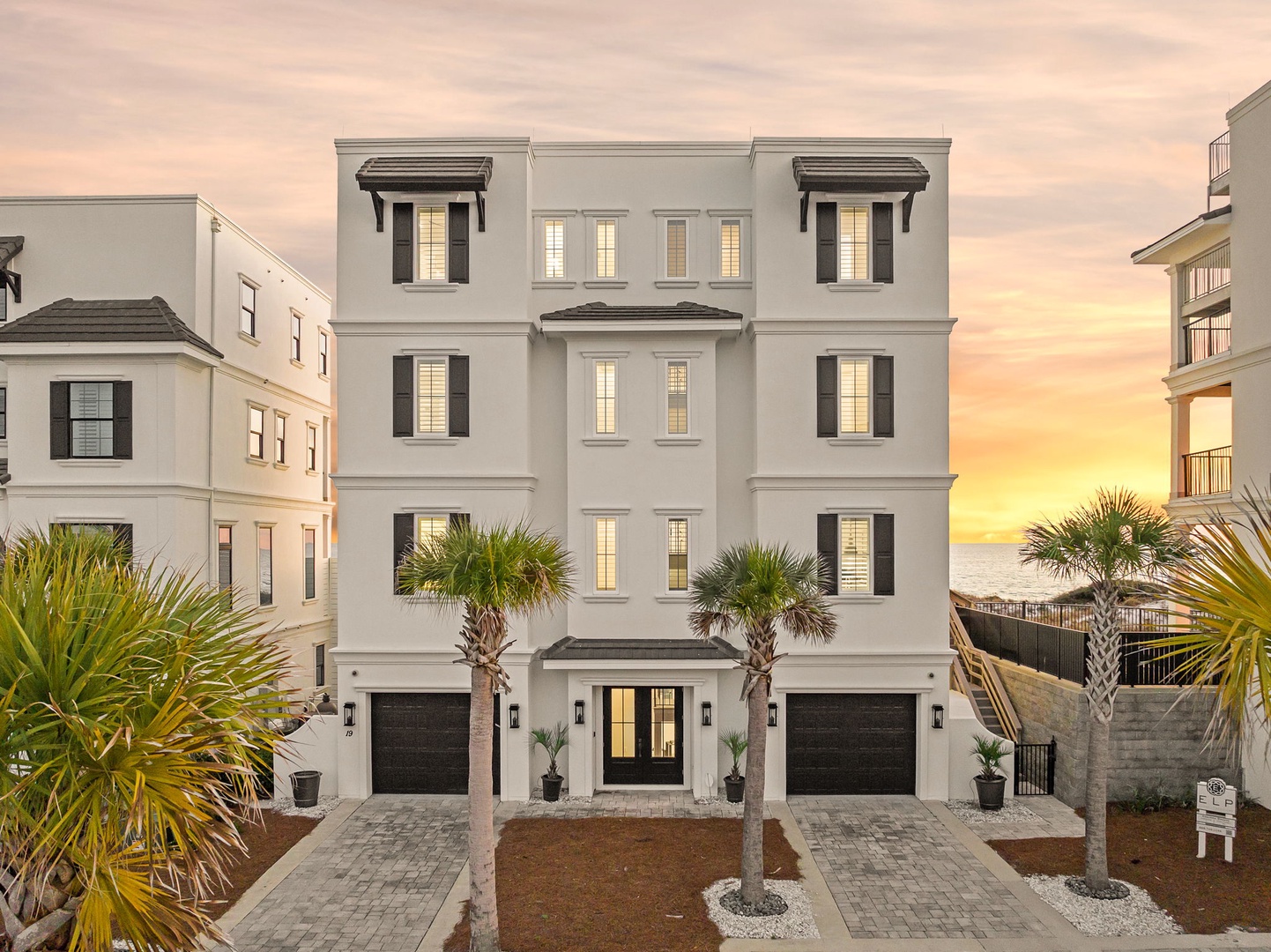 Modern coastal elegance with stunning sunset views over the water from this beautifully designed beachside retreat.