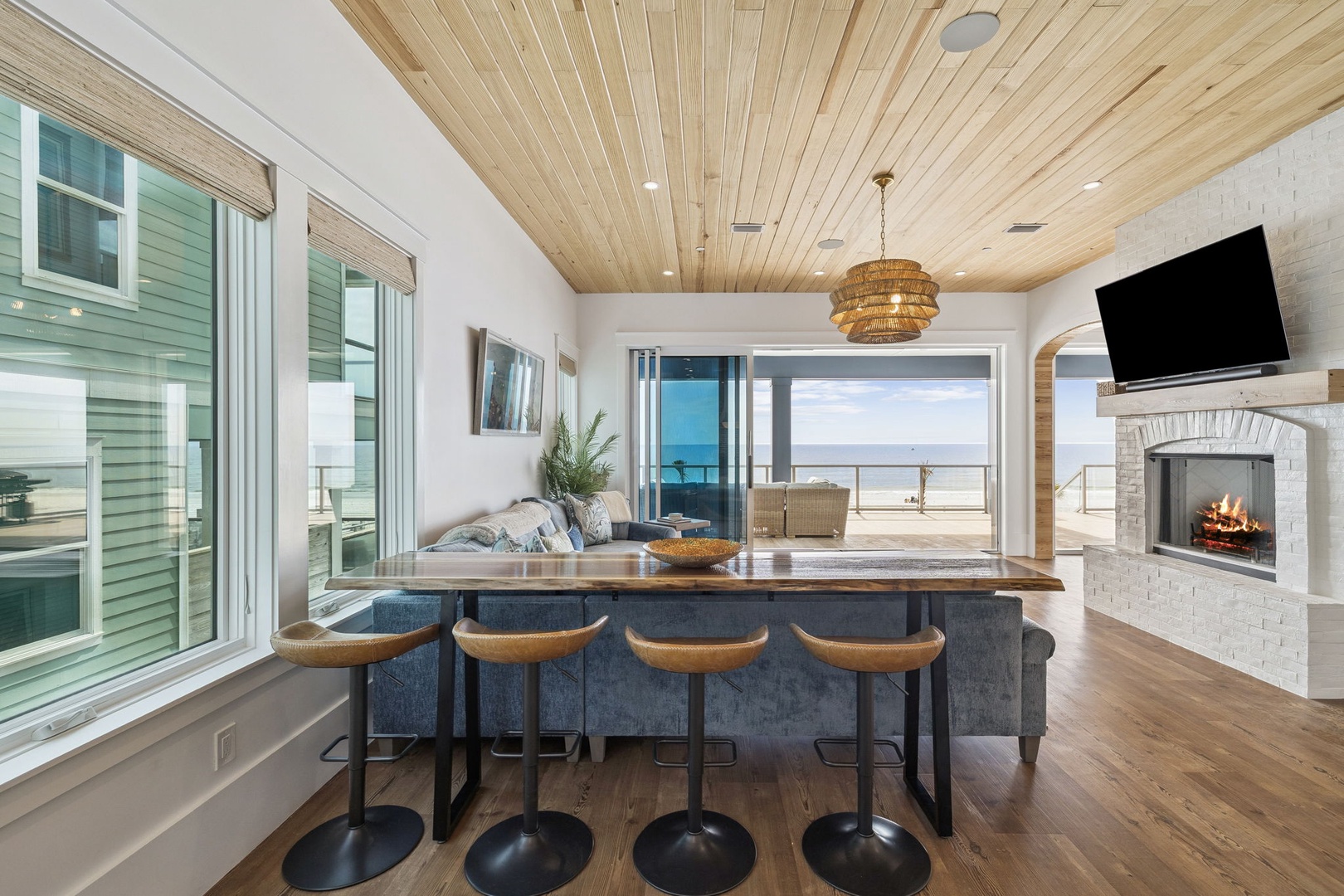 Gather around your spacious island while the fireplace crackles and ocean views stretch endlessly beyond the windows.