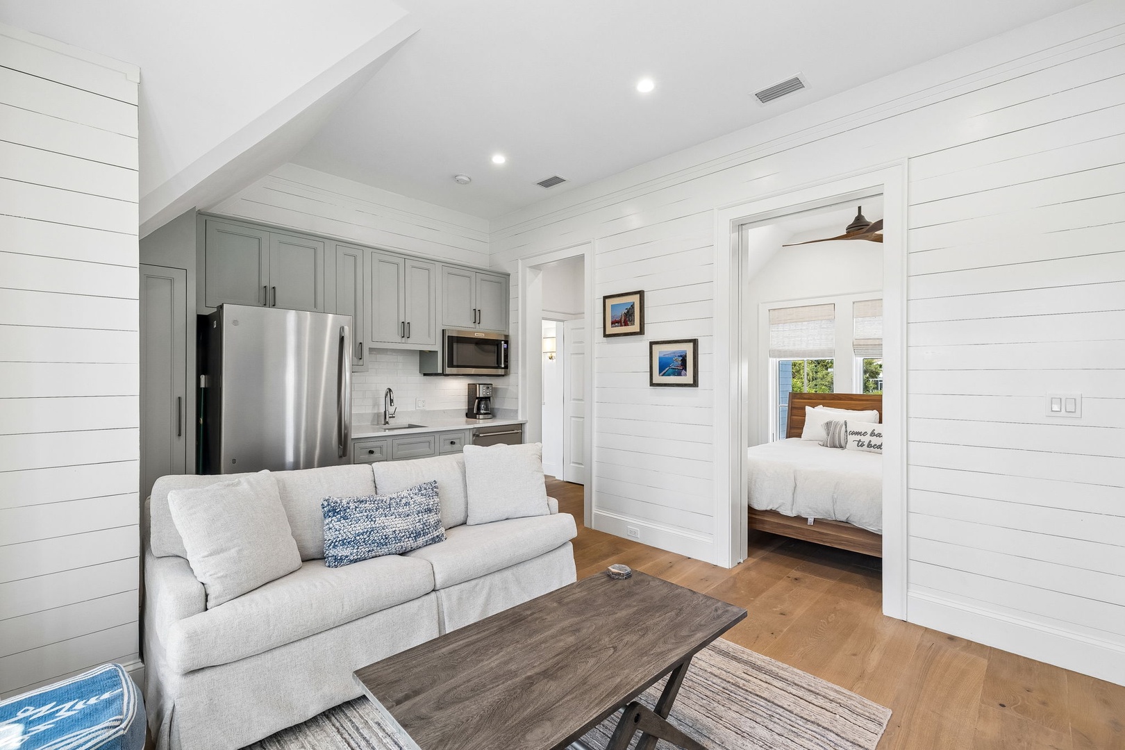Your bright, open cottage blends coastal charm with modern comfort. Relax on the cozy sofa, whip up snacks in your fully-equipped kitchen, and retreat to the serene bedroom just steps away—your peaceful home base.