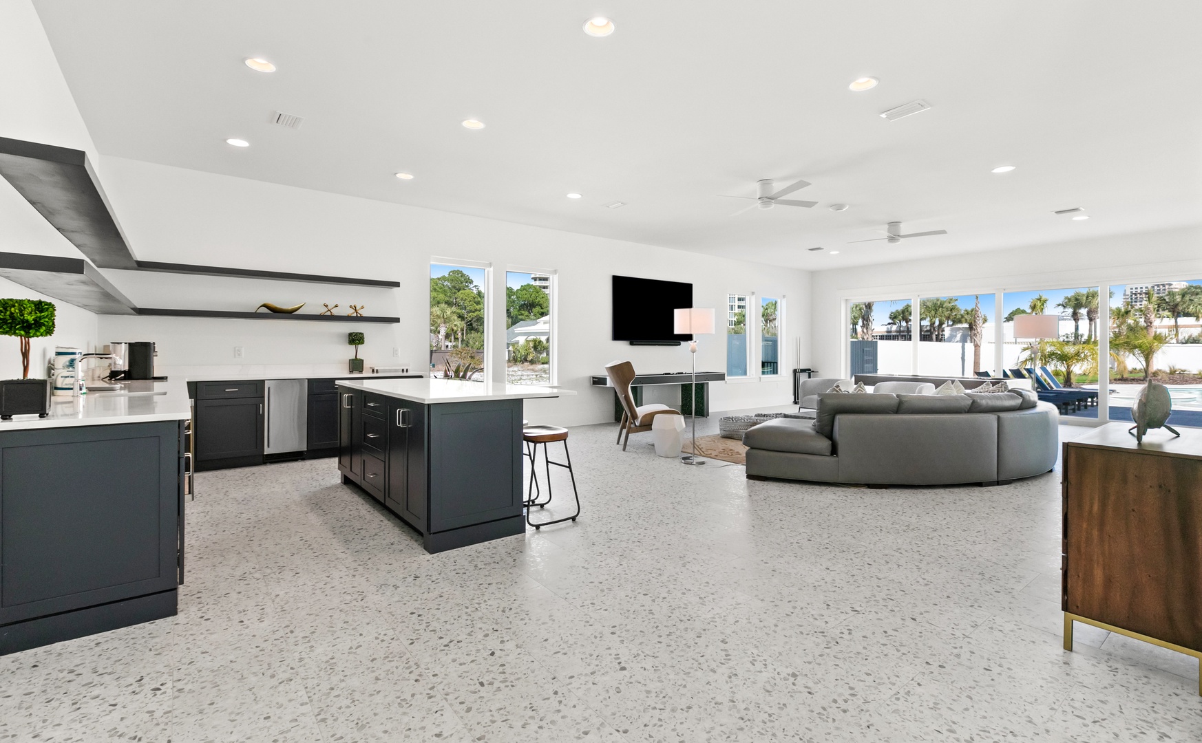 Your open-concept retreat blends sleek style with comfort, where bright natural light floods the modern kitchen and inviting lounge, creating a perfect space to unwind and connect.