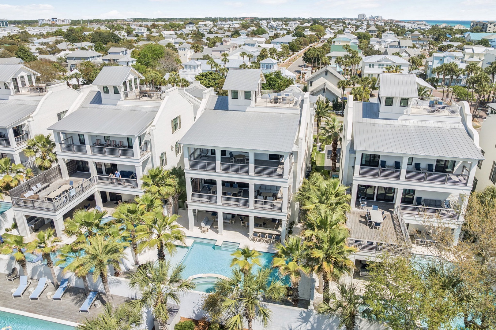 Contemporary beachside resort featuring modern architecture and tropical landscaping in a peaceful coastal community setting.