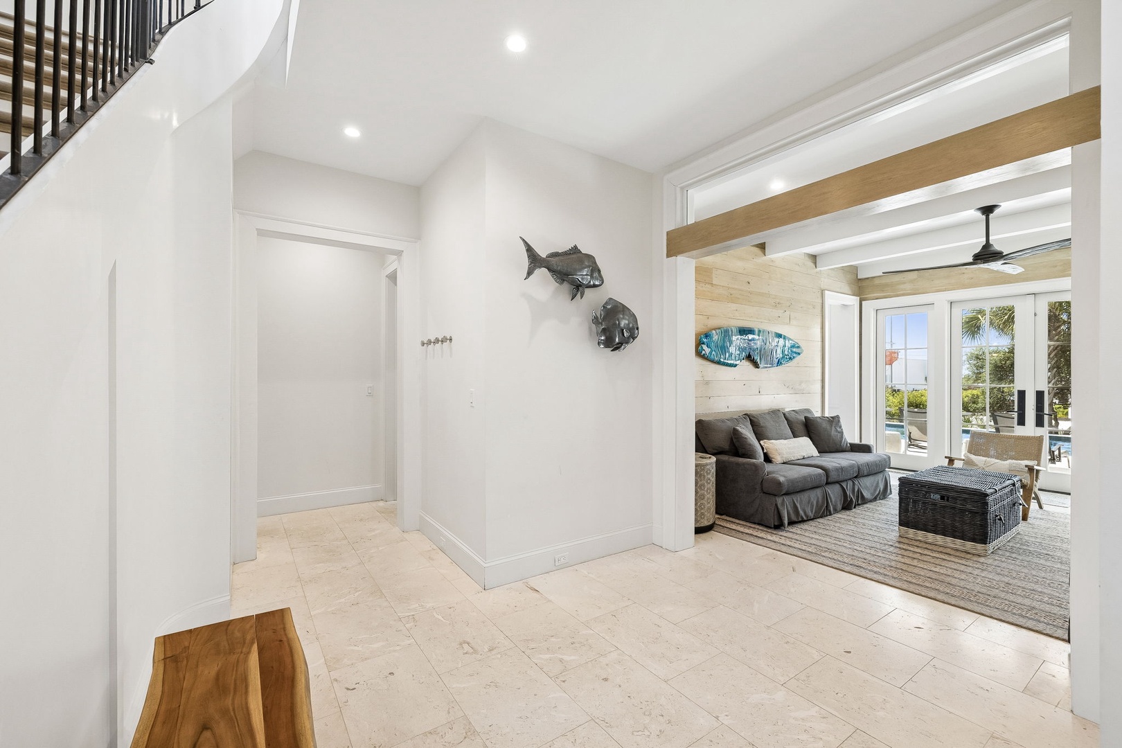 Step into your coastal retreat where whitewashed walls, warm wood accents, and ocean-inspired art create an airy, inviting atmosphere. You'll love the open flow connecting indoor comfort with outdoor living.