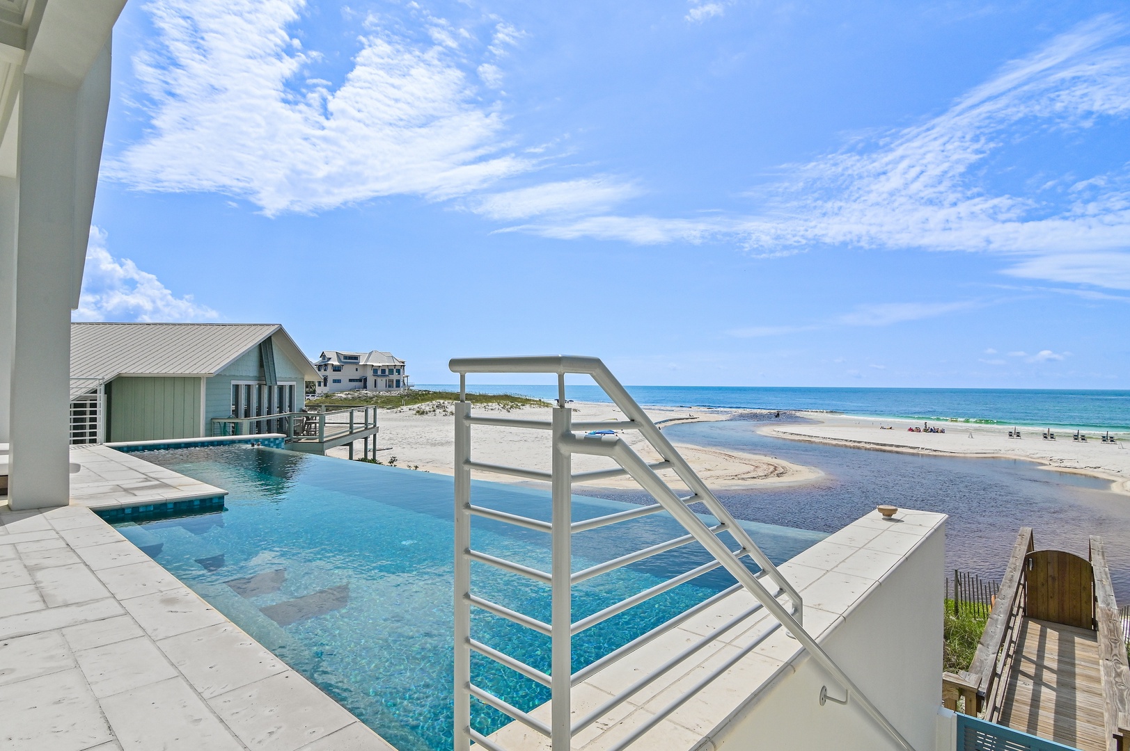 The property features a sparkling private pool overlooking a pristine beach where turquoise waters meet soft sand. Your beachfront escape awaits with direct access to the shore.