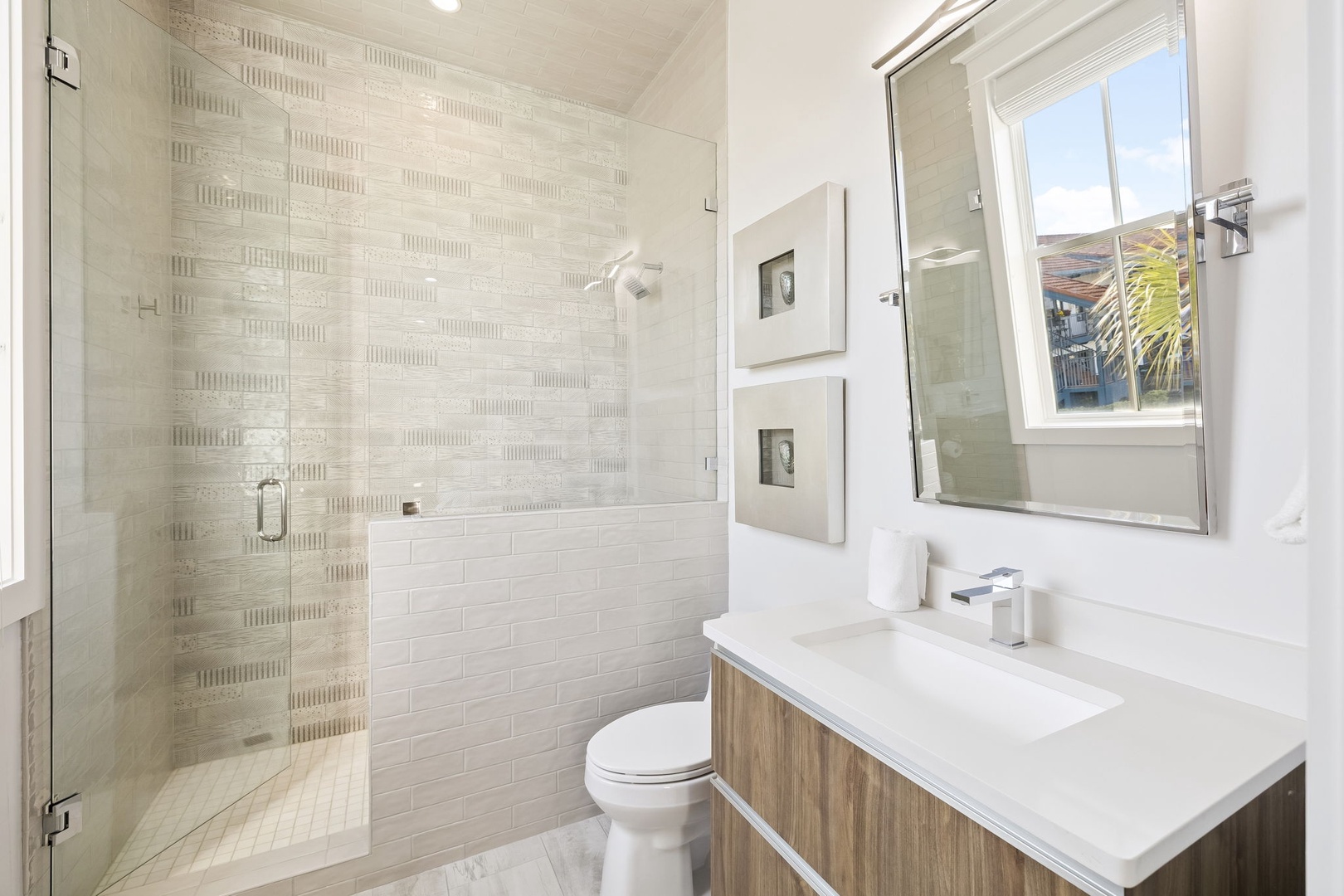 Refresh in your private spa-like bathroom with luxurious walk-in shower, modern fixtures, and bright natural light.