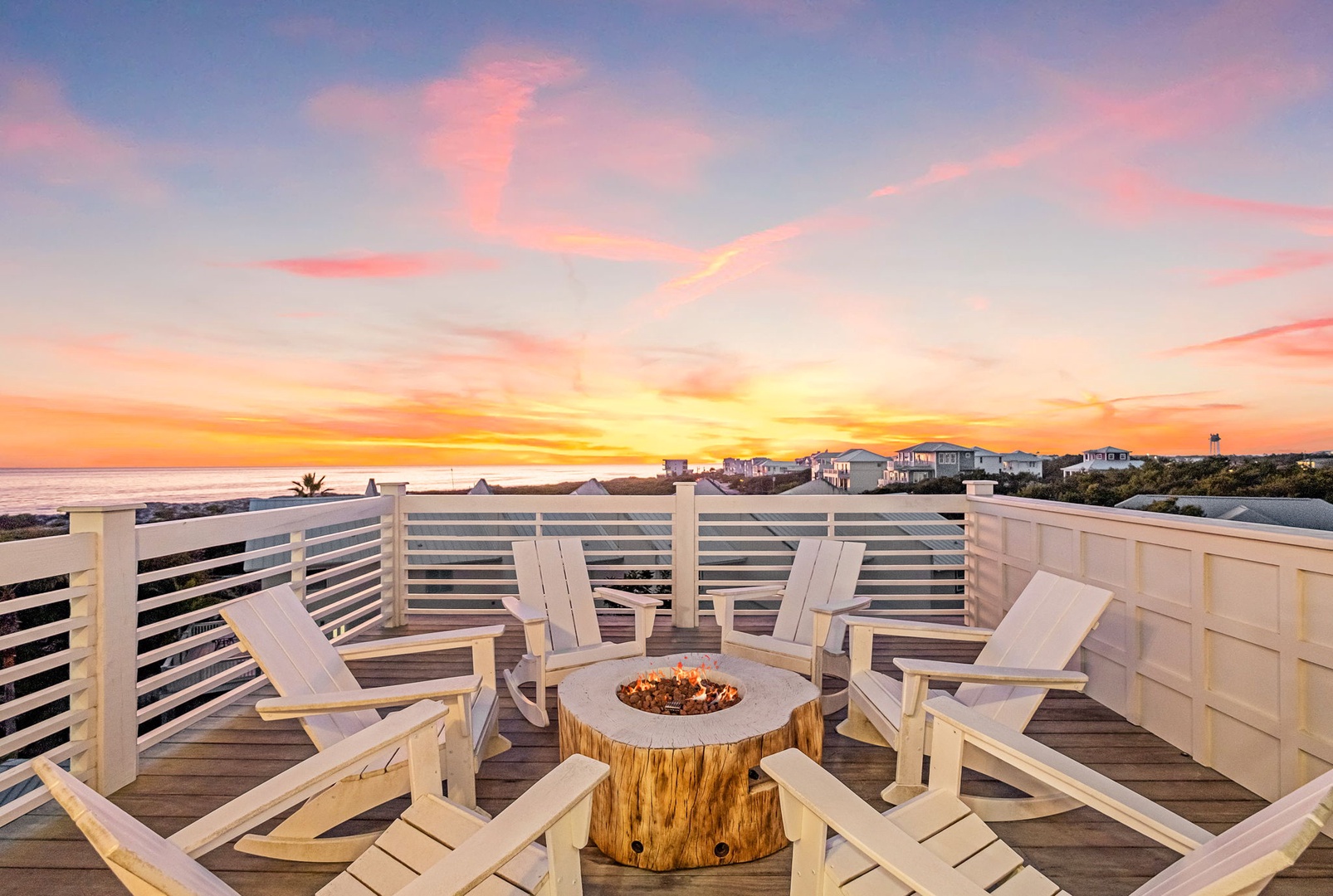 Gather around your private fire pit as the sky transforms into breathtaking pastels, creating magical moments on this stunning rooftop deck.