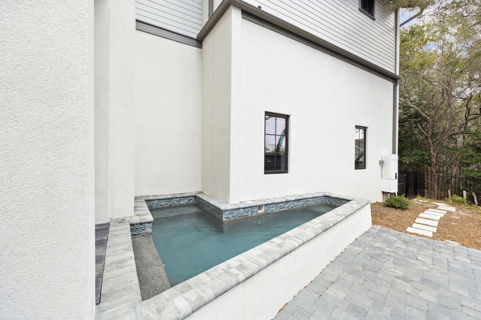 Slip into your private pool sanctuary, where sleek tile meets modern architecture for the perfect poolside retreat.