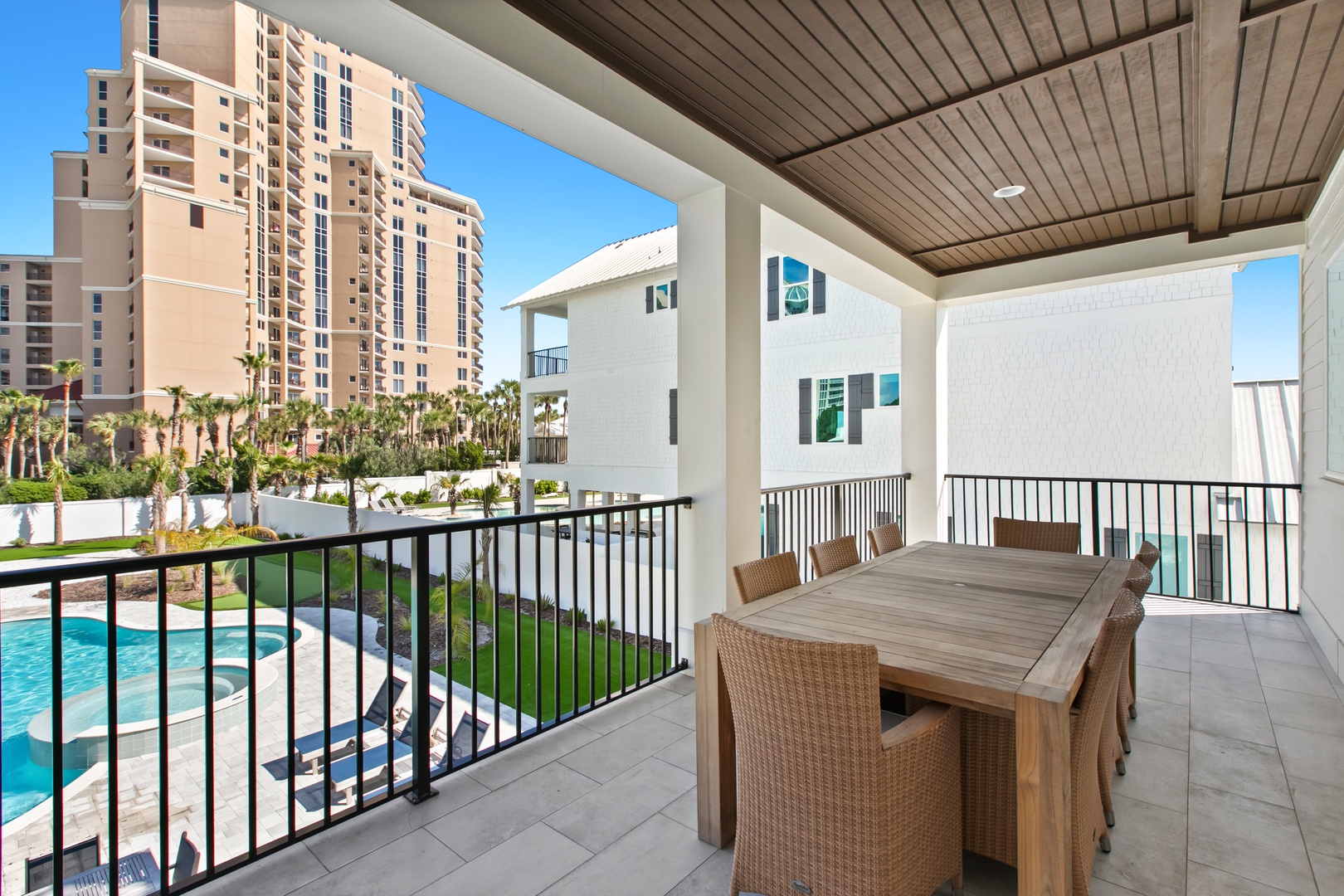 Picture yourself dining al fresco at this spacious covered terrace, where warm breezes and pool views set the scene for memorable meals under a beautifully finished ceiling.