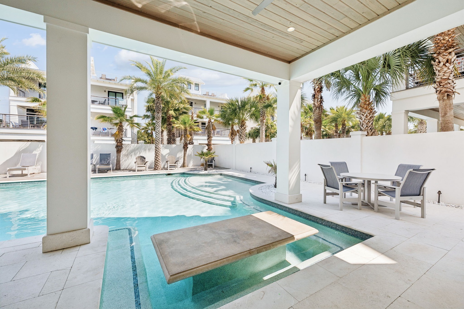 Dive into your private oasis where turquoise waters and palm-lined elegance create the perfect tropical escape.