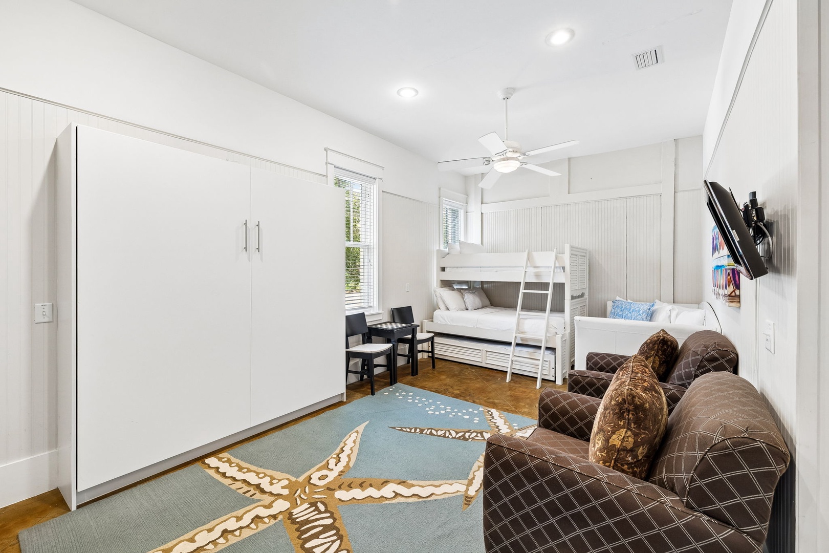 Your kids will love this bright, beach-themed room with cozy bunk beds and plenty of space to relax and play together.