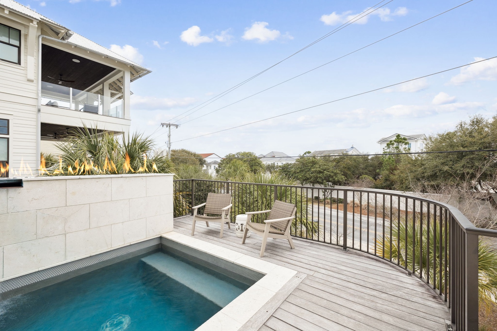 Relax by your private pool on this stunning curved deck, where comfortable loungers await your afternoon escape.