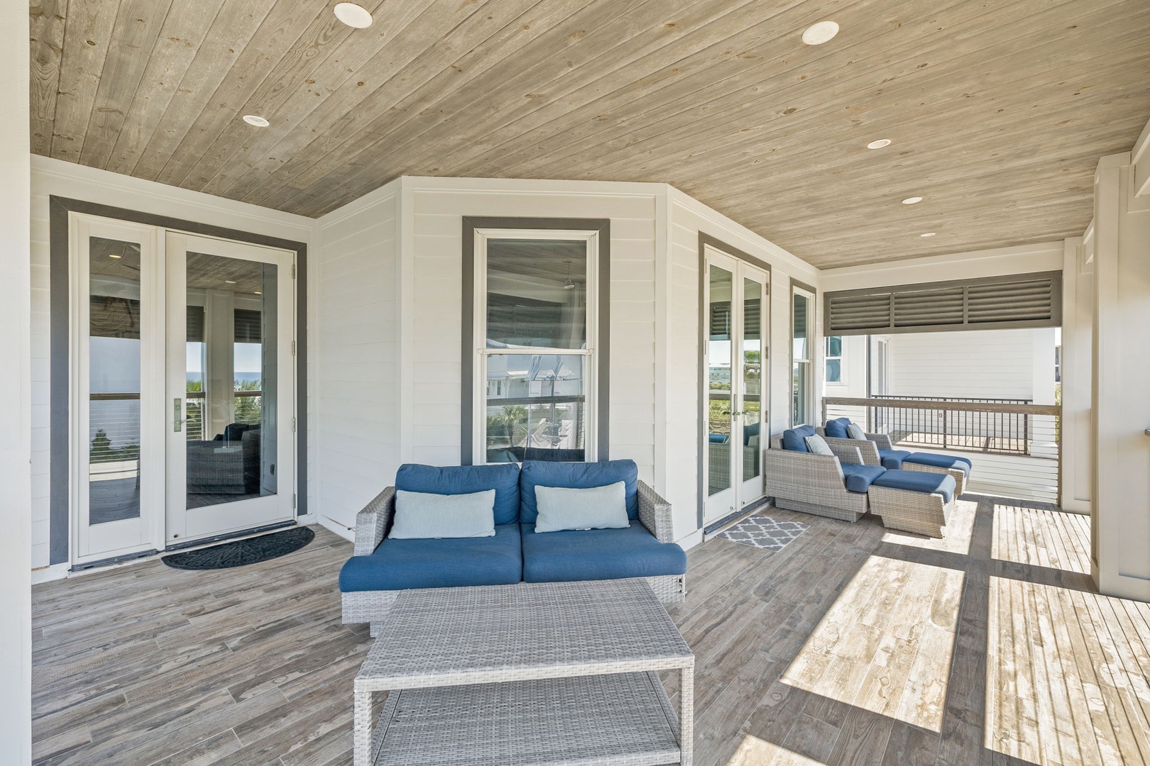 Unwind on your private covered terrace with plush seating and stunning views beyond.