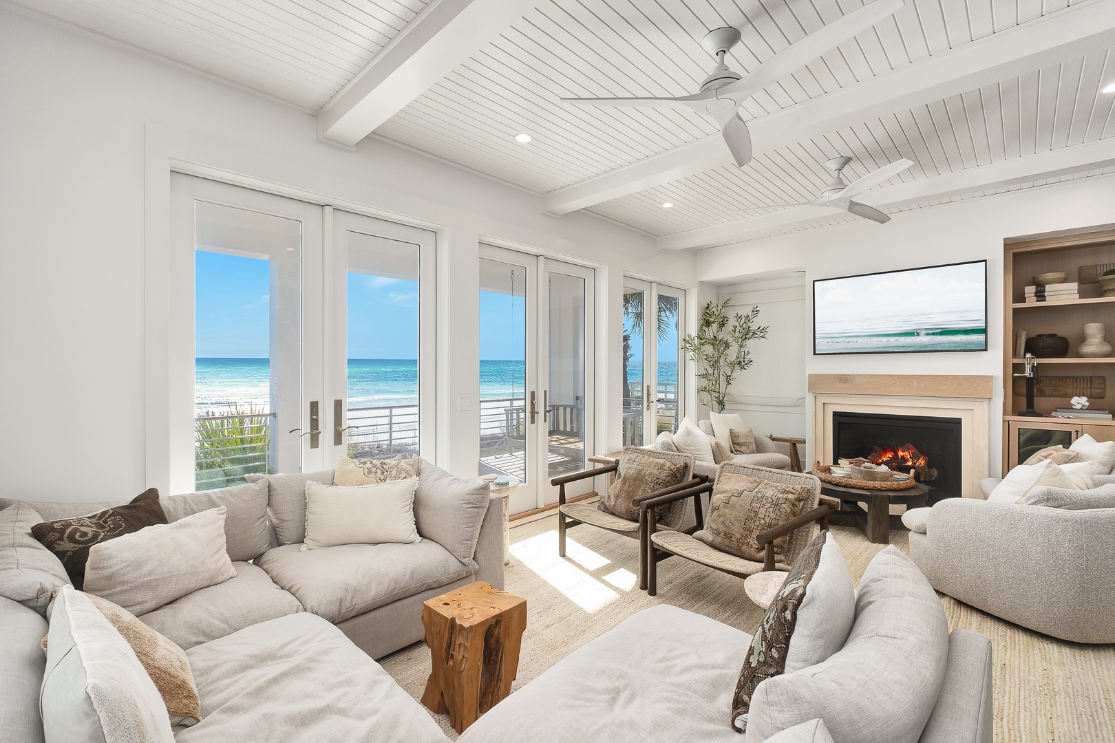 Sink into plush seating by your crackling fireplace while ocean waves roll just steps from your door.