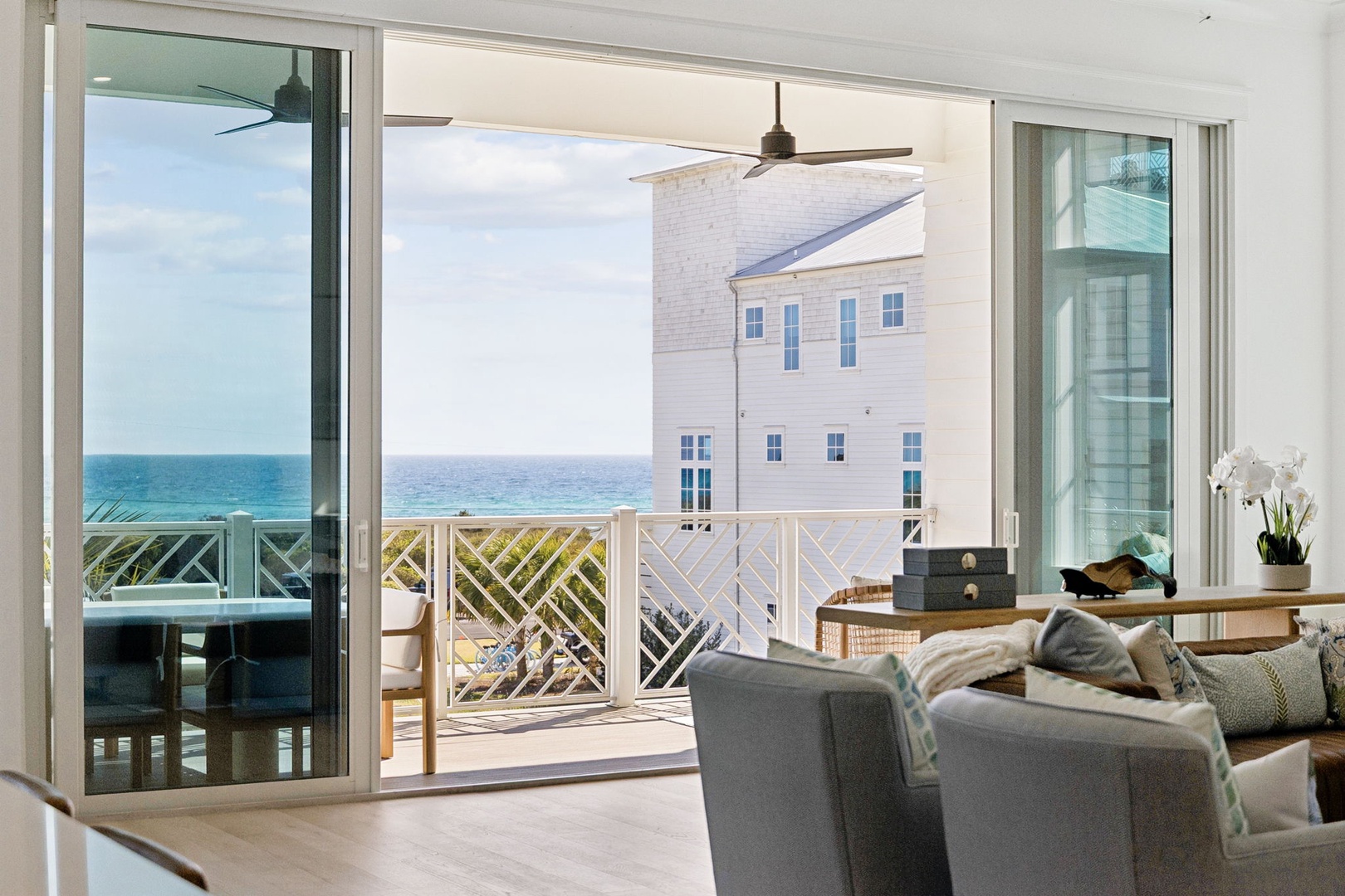 Relax in your bright living space with stunning ocean views through floor-to-ceiling windows that open to your private balcony.