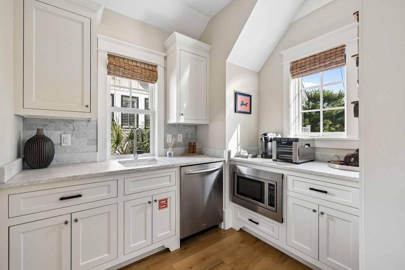 Your fully-equipped kitchen makes meal prep a breeze with stainless steel appliances, sleek marble countertops, and natural light streaming through windows—perfect for easy mornings and relaxed evenings.