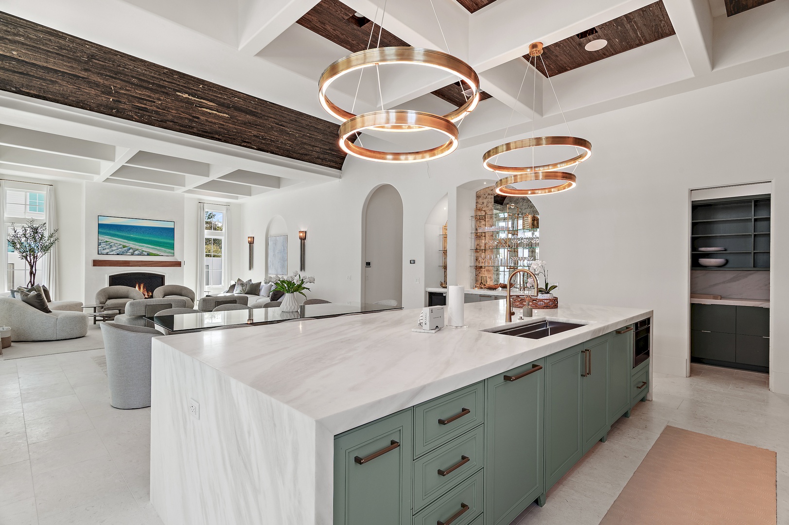 Picture yourself preparing meals in this stunning open-concept kitchen, where gleaming marble countertops and designer lighting create an atmosphere of effortless elegance. You'll love the seamless flow into your inviting living space.