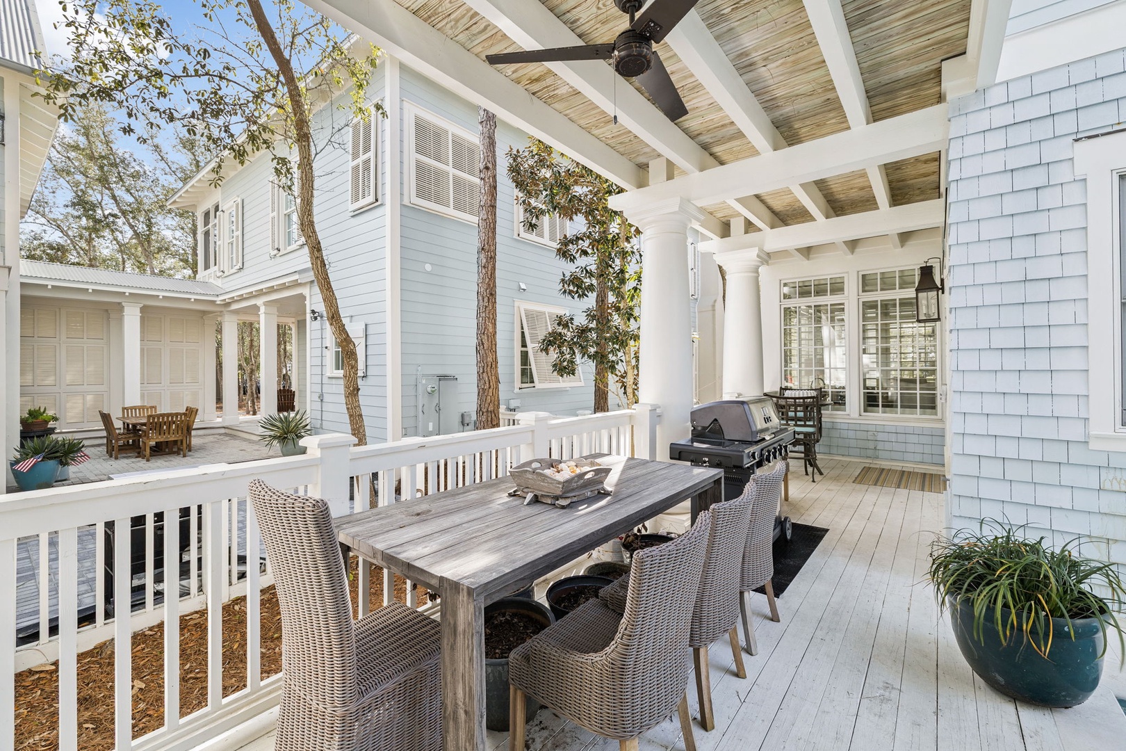 Gather around your private covered terrace with dining table, BBQ grill, and peaceful courtyard views for memorable outdoor meals.