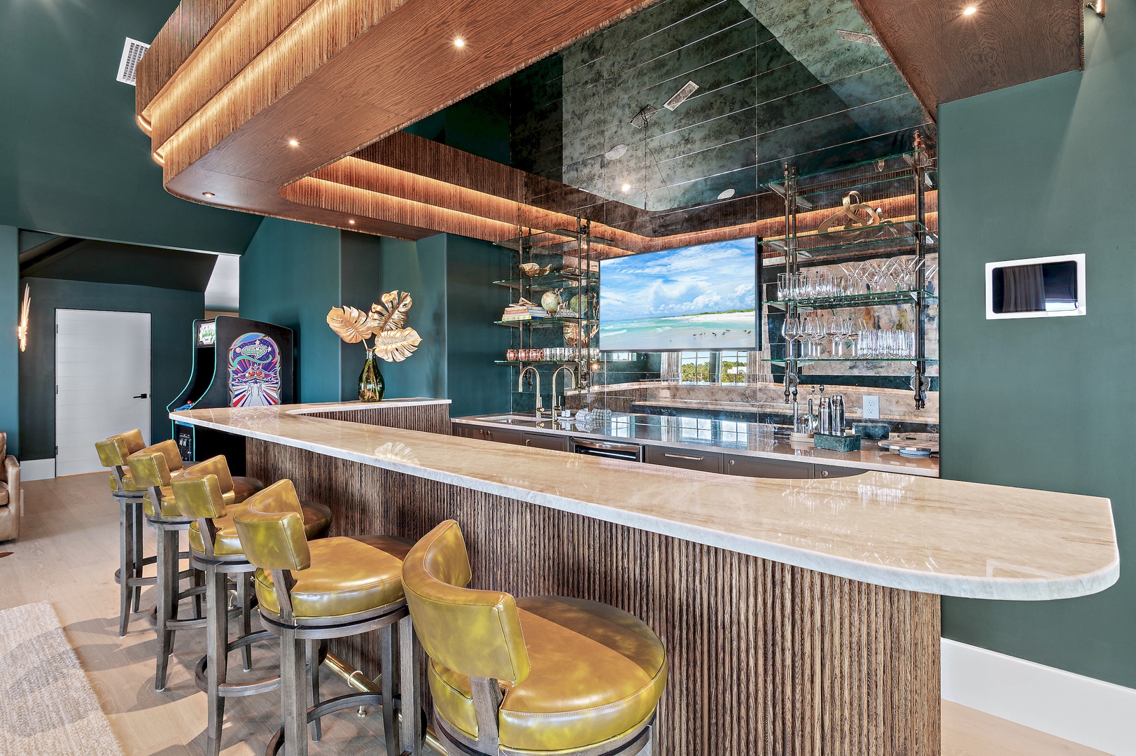 The sleek bar features elegant bar seating, a mirrored backsplash, and striking wood-paneled ceilings, creating an inviting space to unwind with your favorite drink.