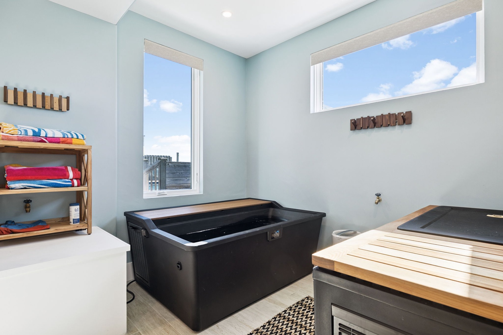 Unwind in your private spa sanctuary with a sleek hot tub and sauna, complete with fresh towels and city views.