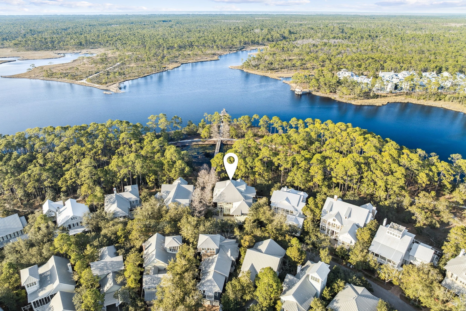 Stunning lakefront community nestled among towering pines, featuring waterfront access and pristine natural surroundings.