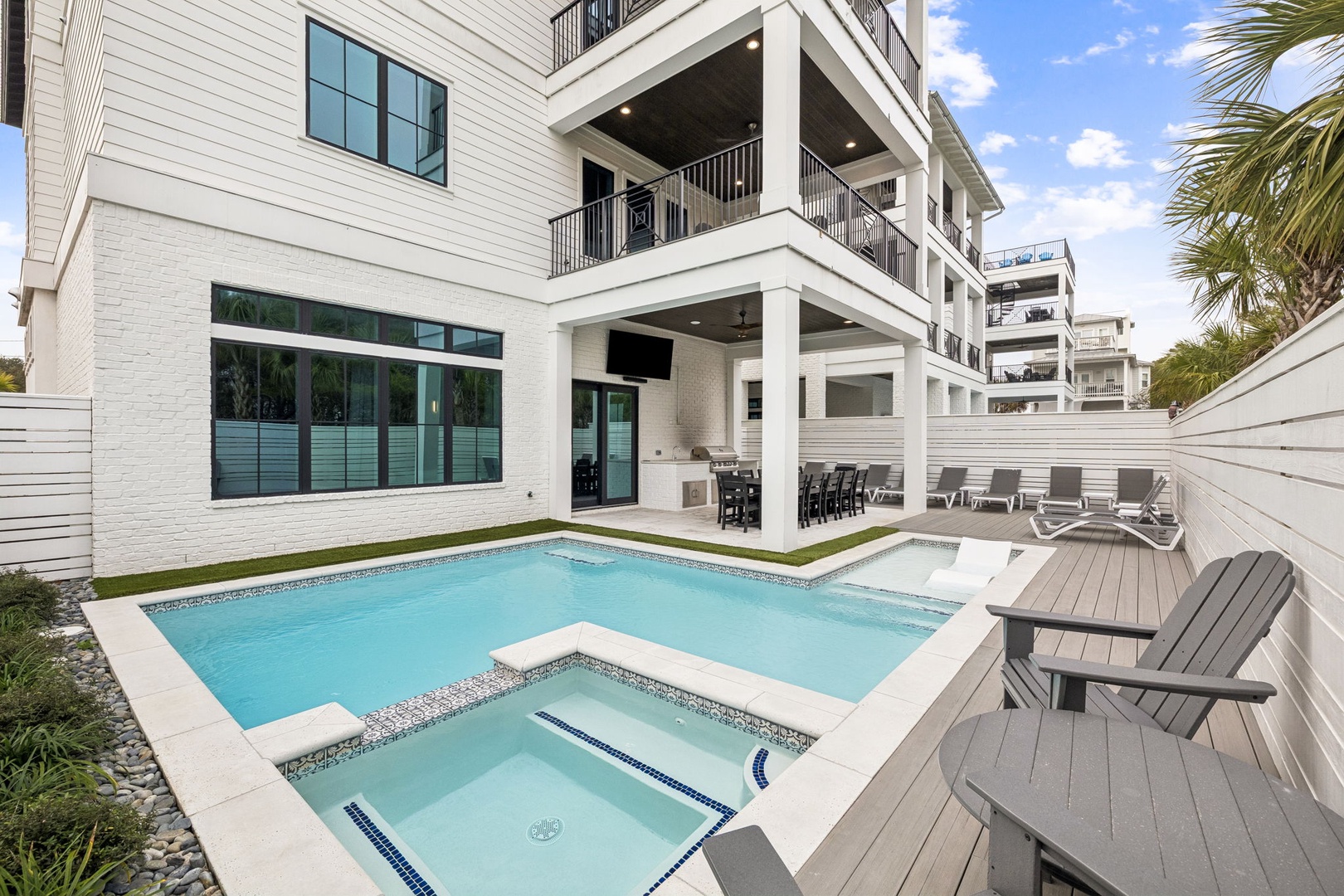 Step into your private oasis featuring a sparkling pool and spa perfect for unwinding after beach days.