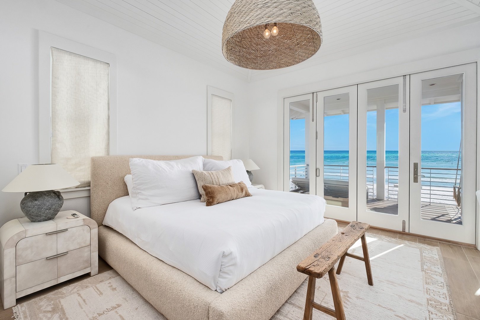Wake up to endless ocean views from your serene bedroom sanctuary with direct balcony access to the sea.
