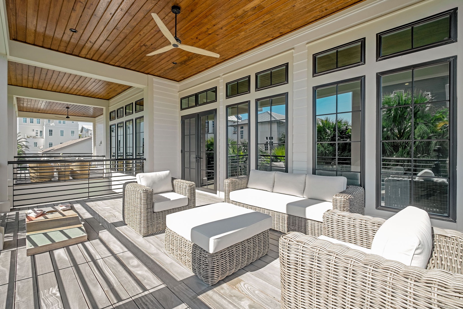 Relax in your private covered terrace with plush wicker seating and ceiling fans, perfect for enjoying tropical breezes.