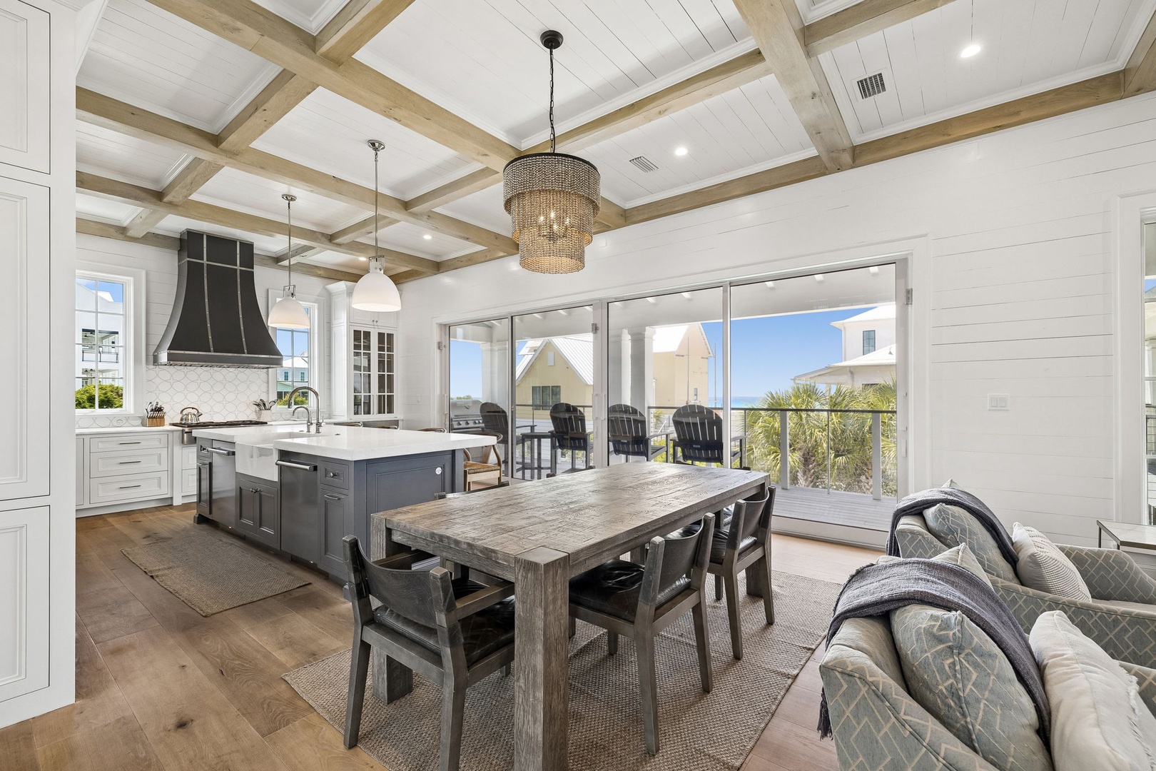 Step into a bright, open-concept space where rustic beams meet modern elegance. Your gourmet kitchen flows into a dining area perfect for gathering, while sliding doors open to a private balcony with refreshing breezes.