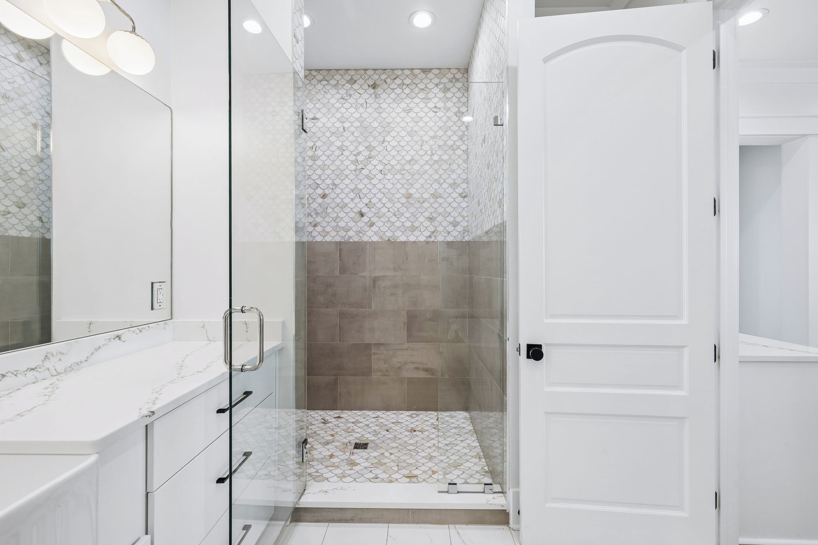 Slip into your private spa-like retreat, where elegant tilework and a spacious walk-in shower invite you to wash away the day's adventures in style.